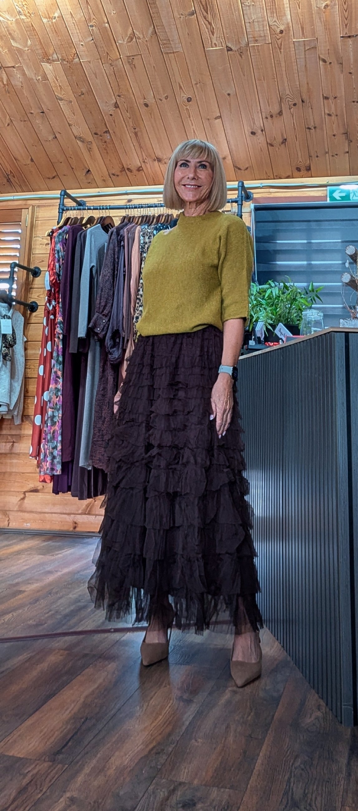 Tasha long chocolate tulle skirt styled with green sweater