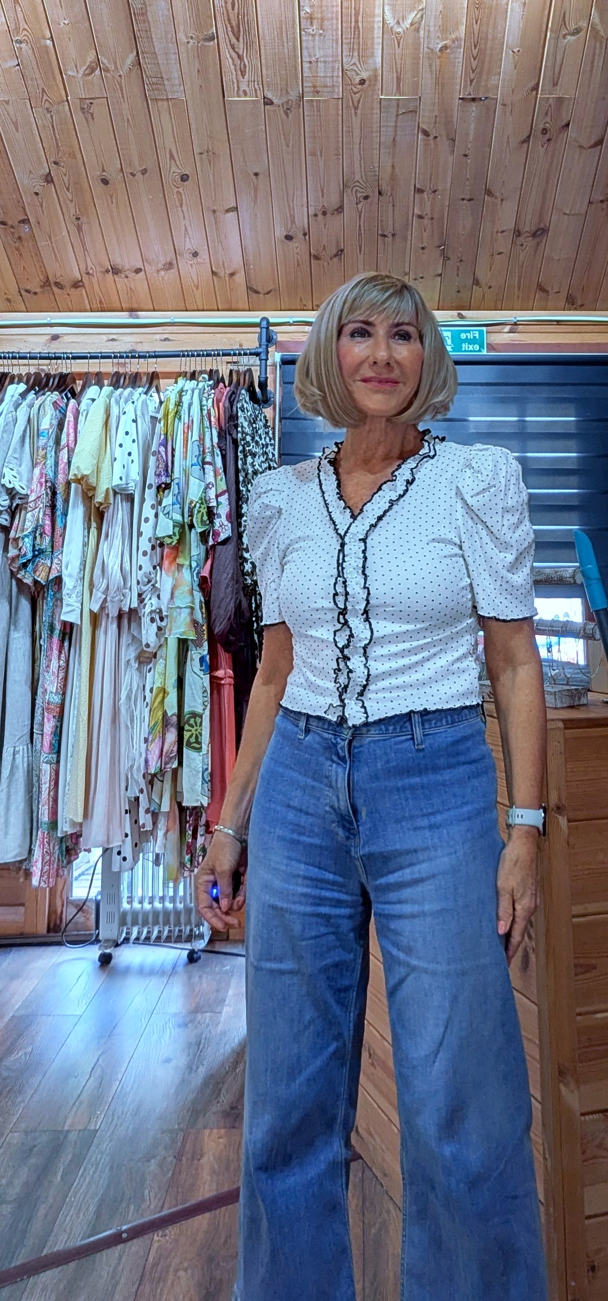 Tatum white cotton polka dot blouse with black ruffle trim and puff sleeves styled by ditsydi uk