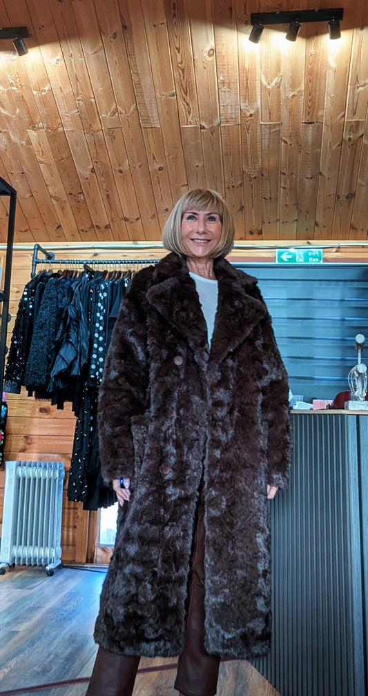 Closer view of Nova chocolate faux fur coat showing its plush texture and wide lapel collar.