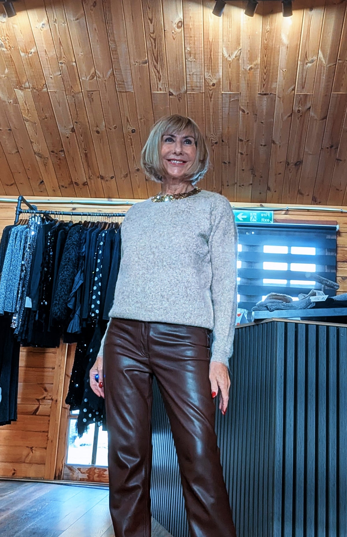 Front view of the Pixie taupe jumper with long sleeves and a decorative neckline