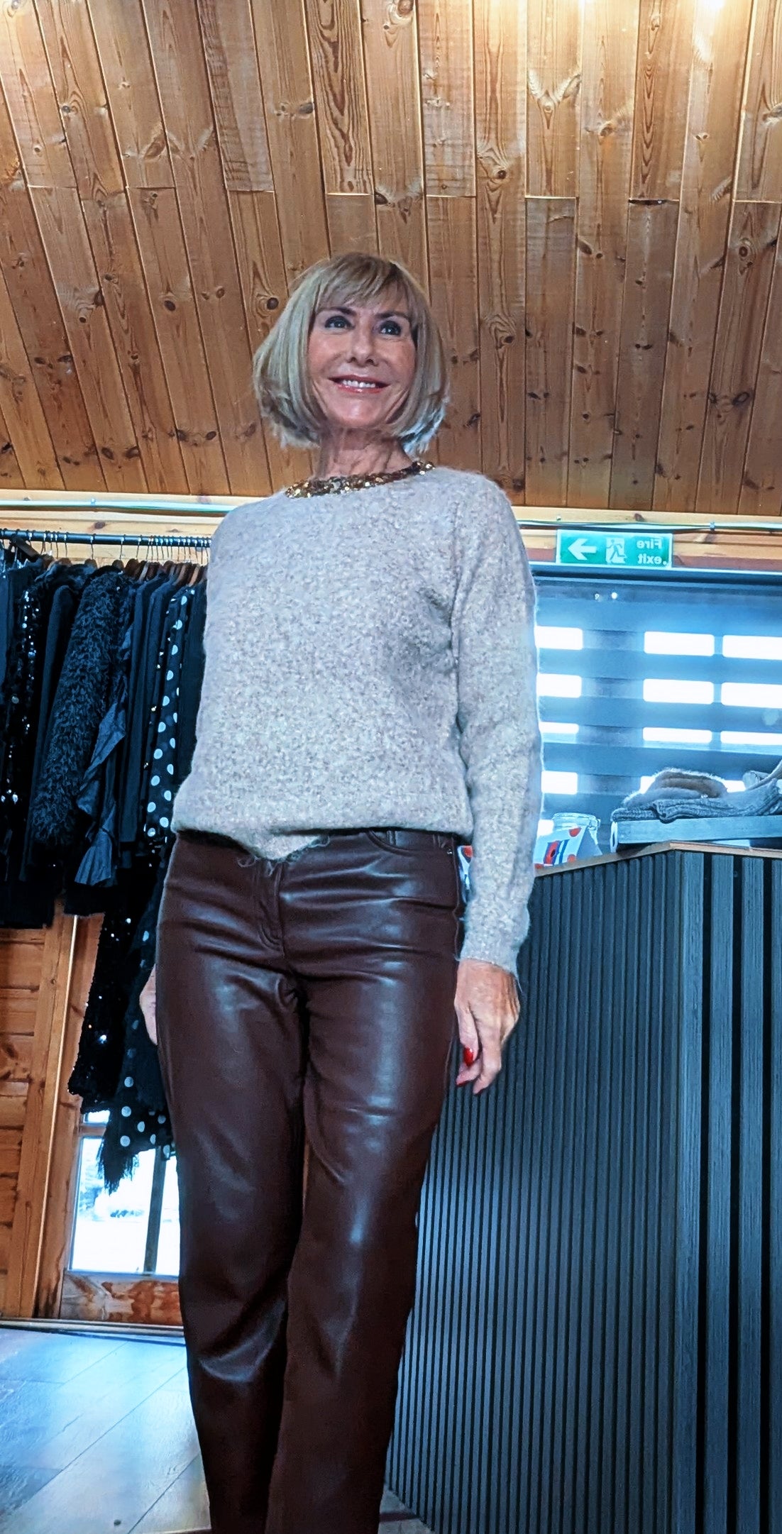 Pixie taupe knit jumper styled with chocolate trousers in the boutique