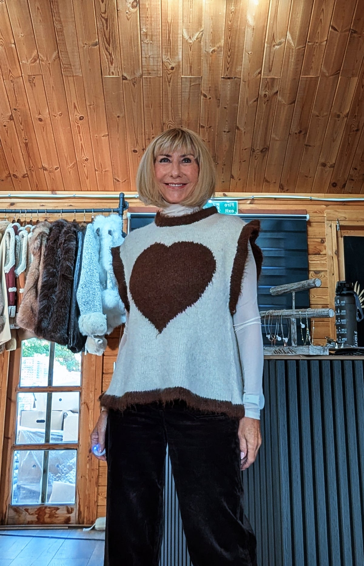 Maura knitted tank top showing the large heart motif and brown neckline trim