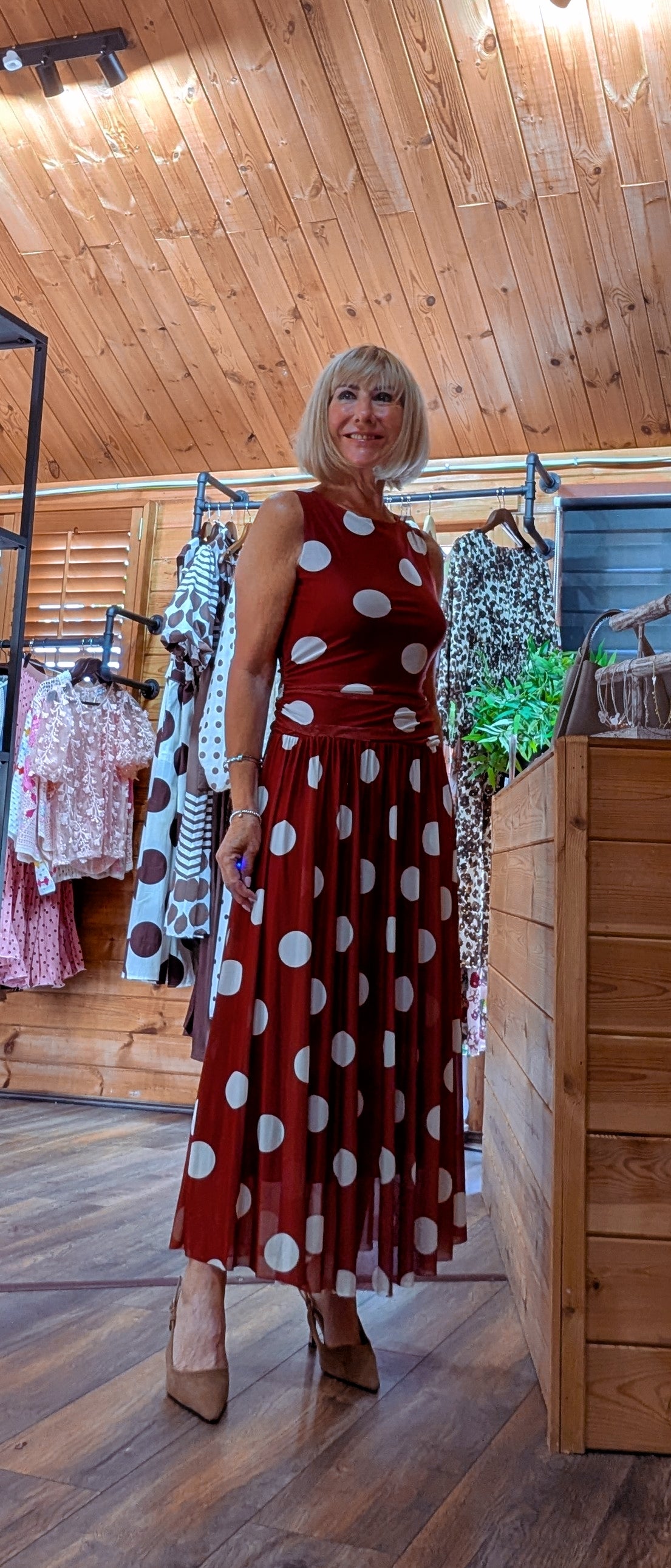 Full-length view of the Rumer sleeveless polka dot occasion dress