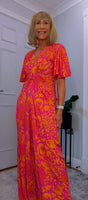 Justina Tropical Green - Fuchsia -Angel Sleeve Maxi Jumpsuit with Twist Detail