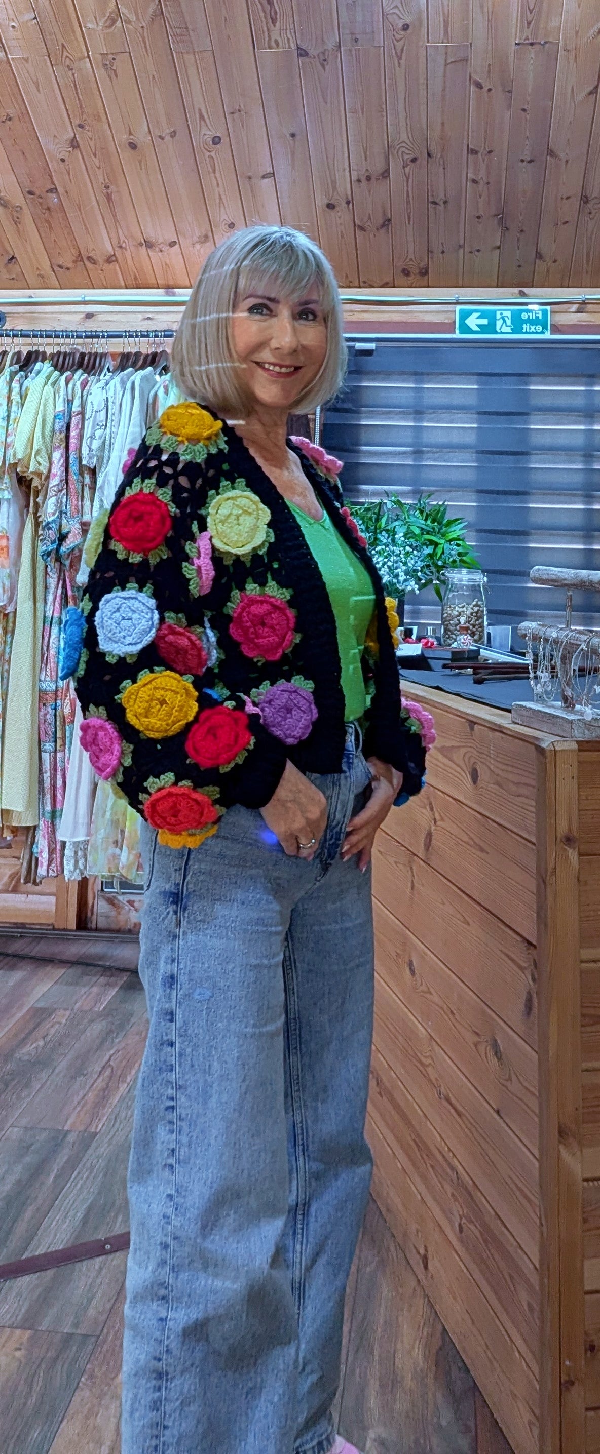 Colourful 3D flower cardigan styled with denim