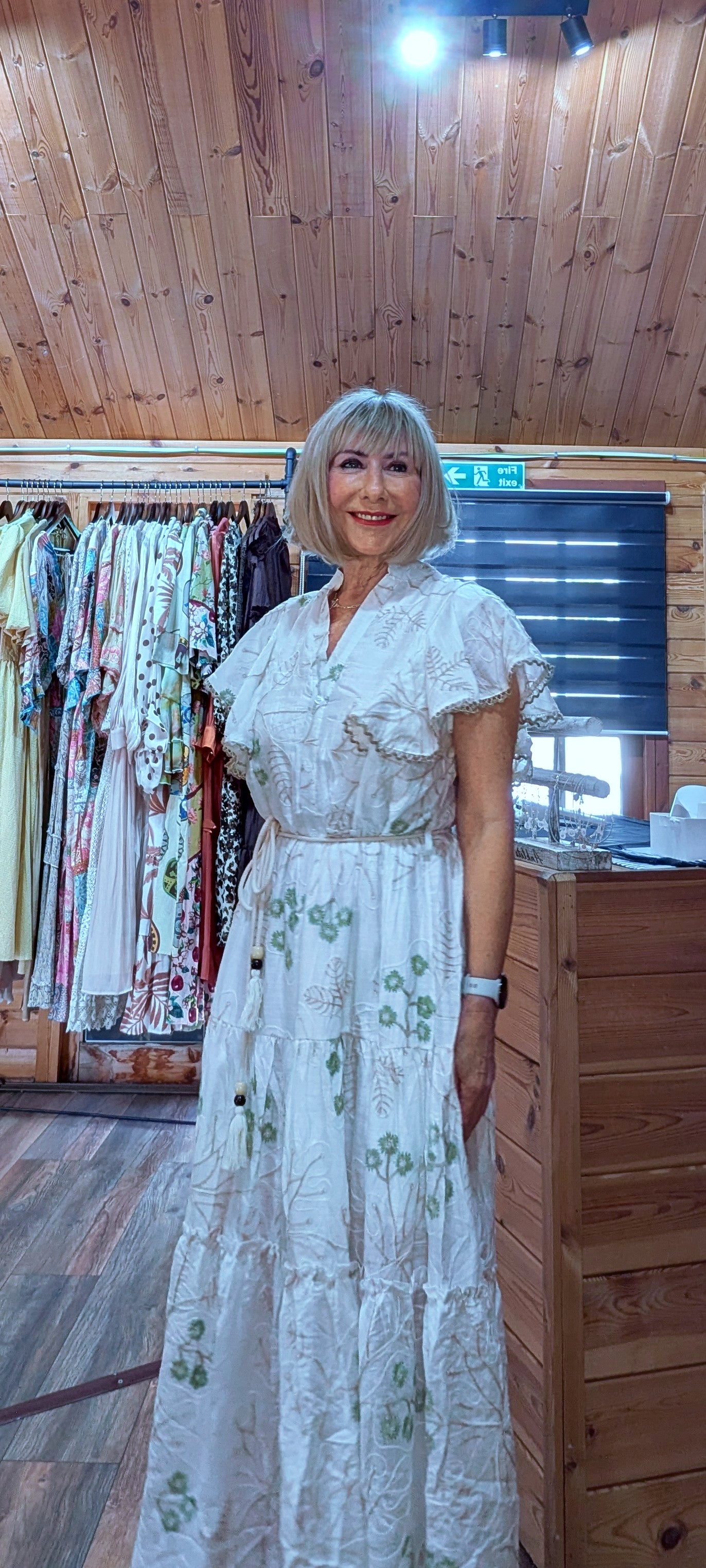 Charity embroidered midi dress styled in summer setting