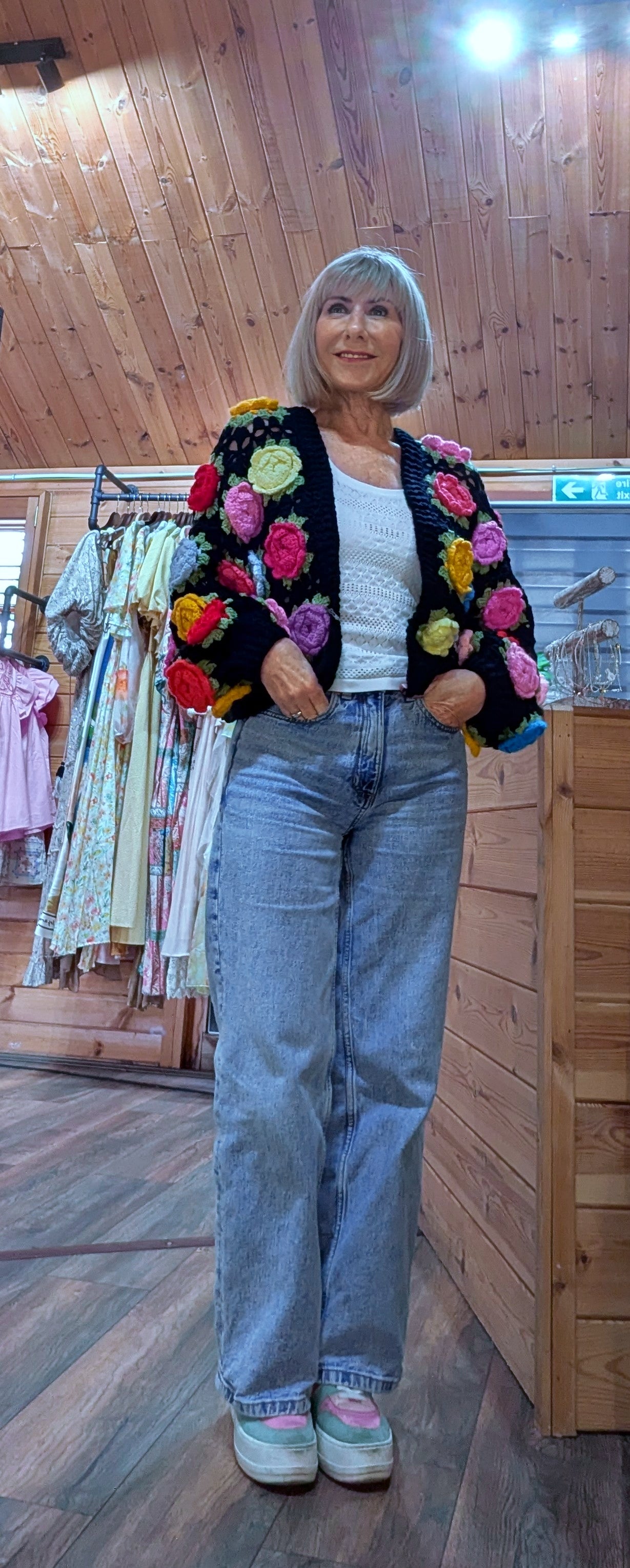 Black statement cardigan with colourful crochet flowers