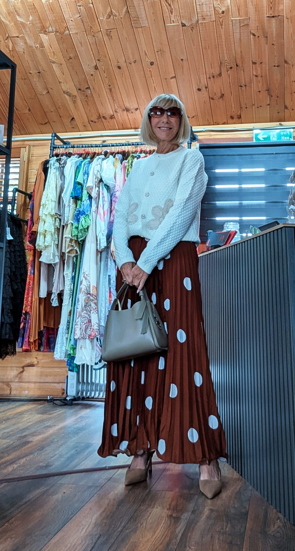 Aviary ivory cardigan with gold button front and embroidered floral detail worn with Trinny skirt styled with a handbag. Autumn outfit UK boutique