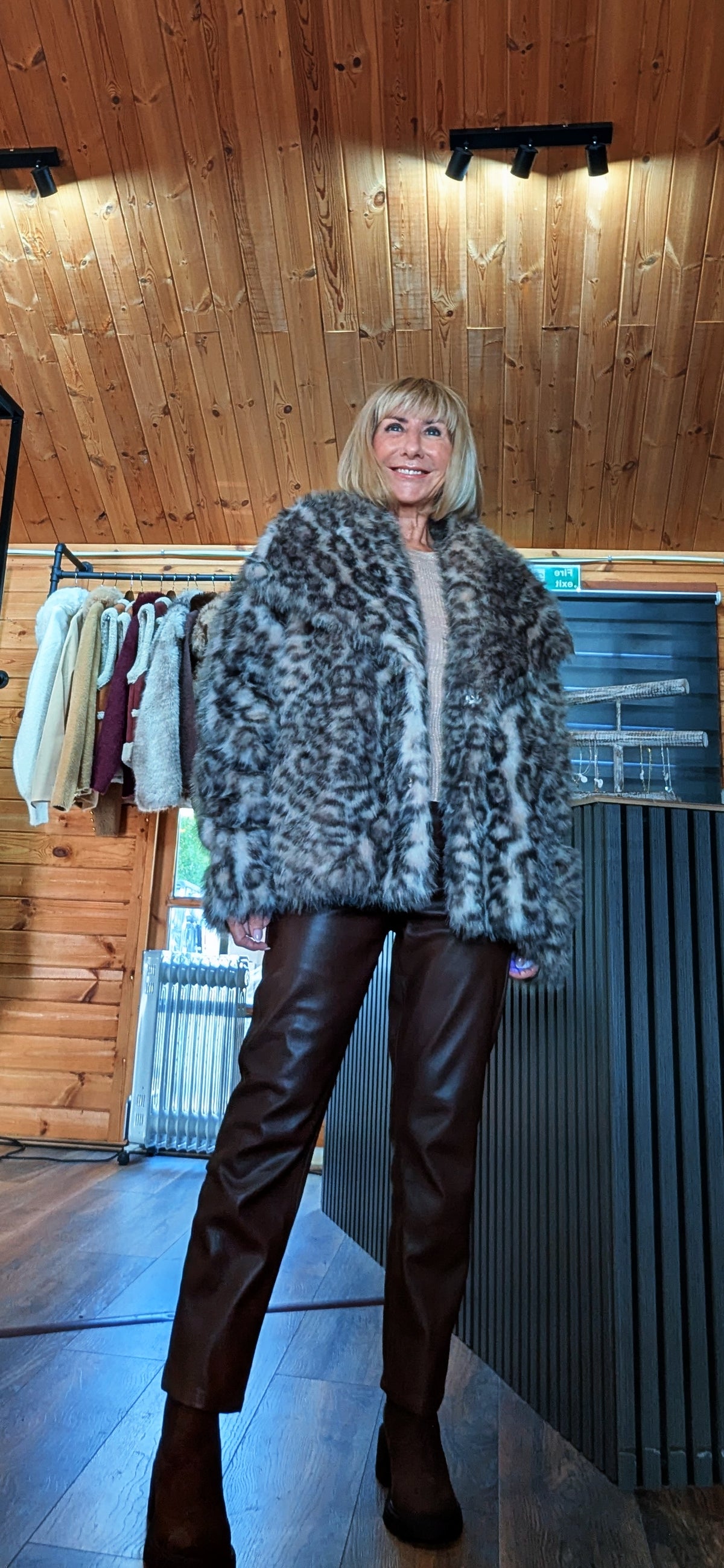 Close up view of a luxury faux fur jacket with statement collars