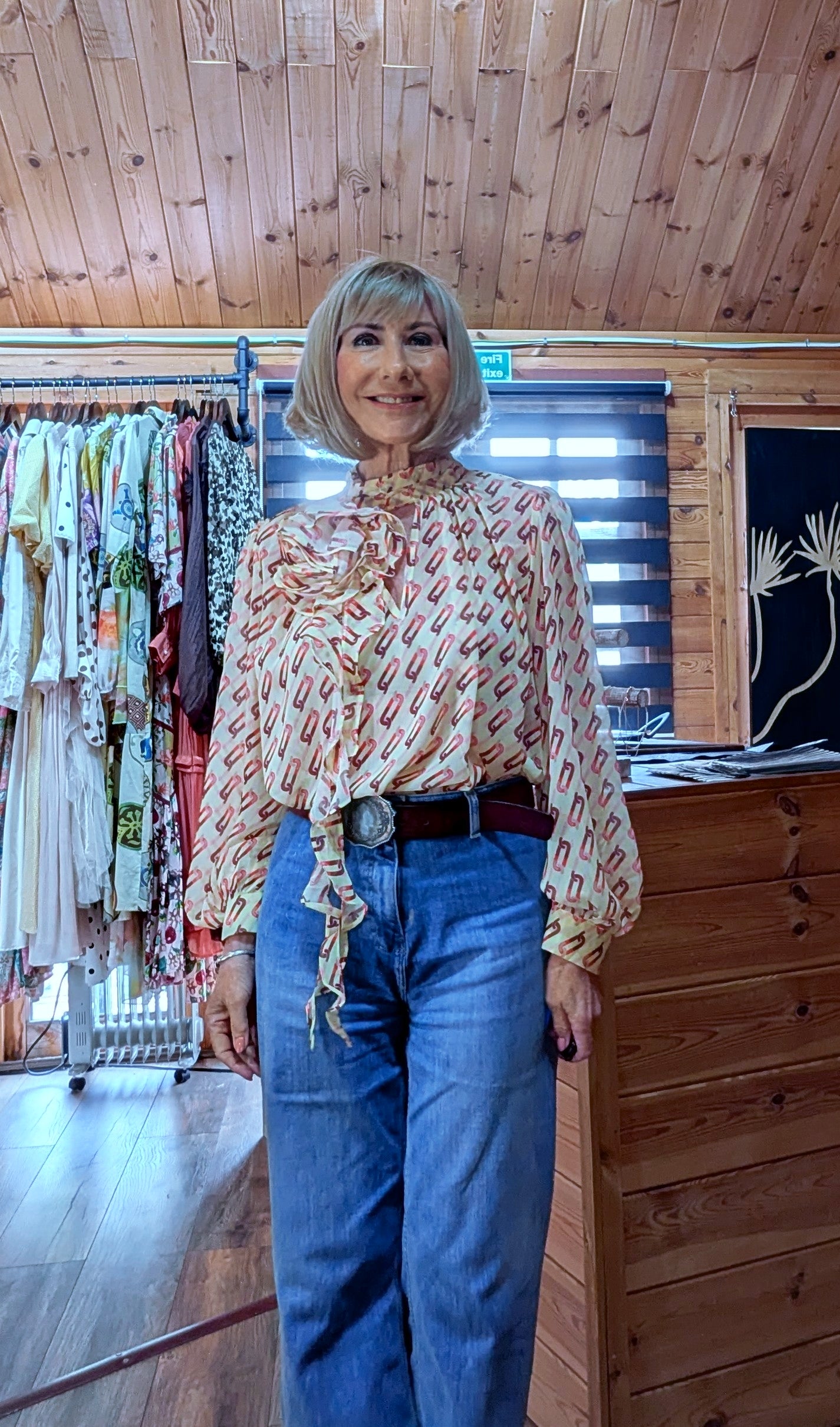Women's floral print blouse featuring statement flower detail and long balloon sleeves 
