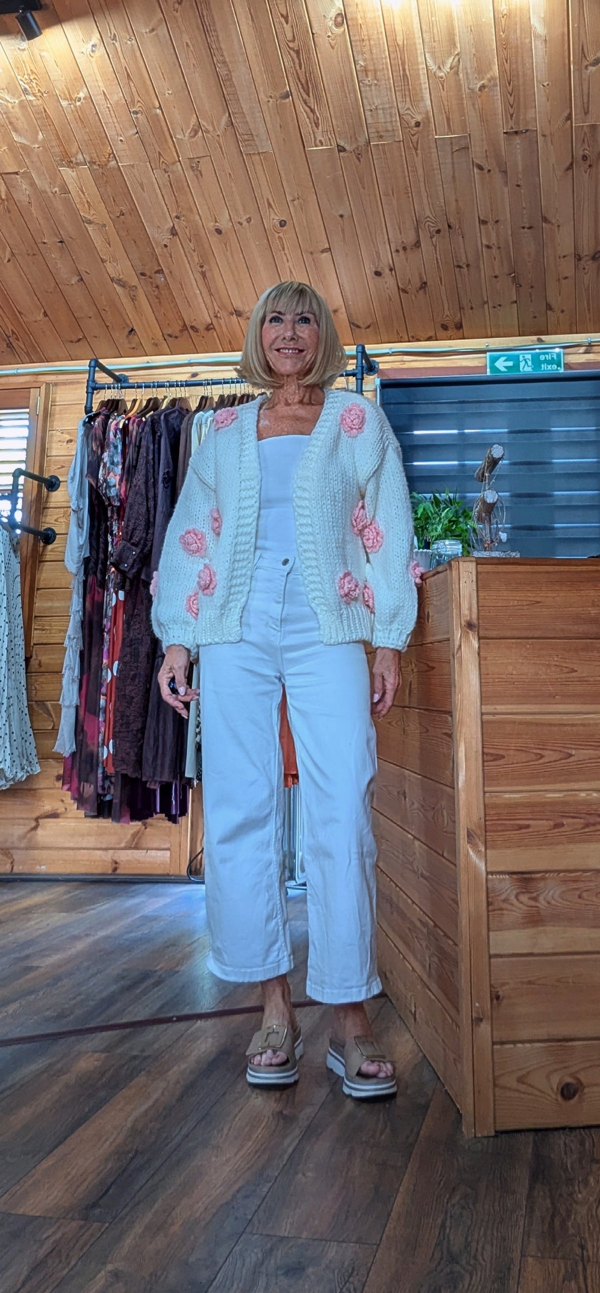 Rose cream open-front cardigan with pink floral appliqué and statement sleeves