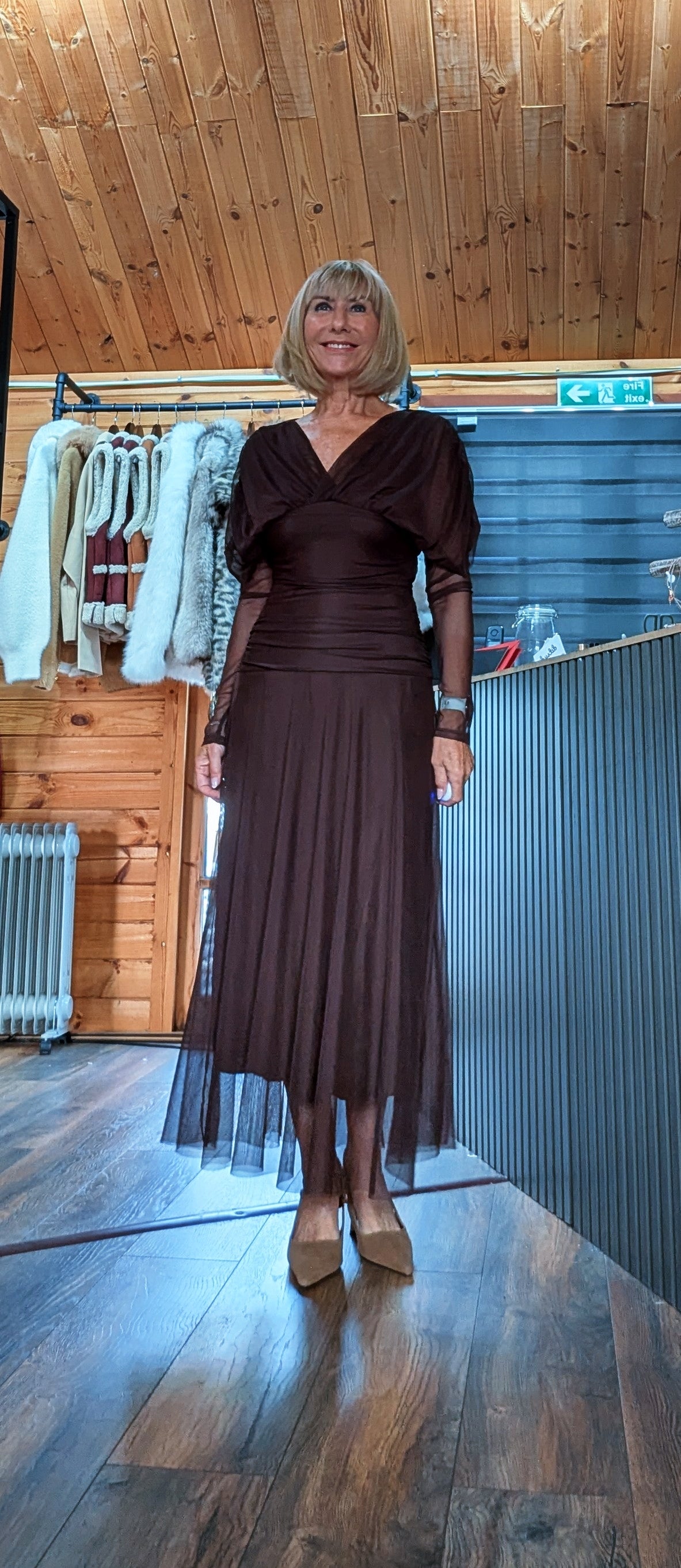 Luna chocolate tulle dress shown from the front with its full skirt length and sheer hem