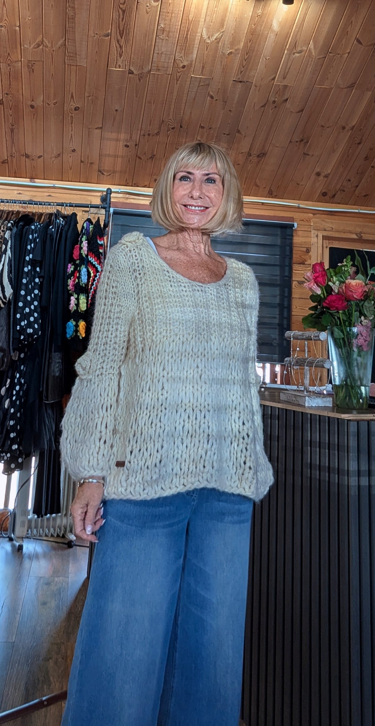 Dolly cream textured knit jumper styled with wide leg jeans