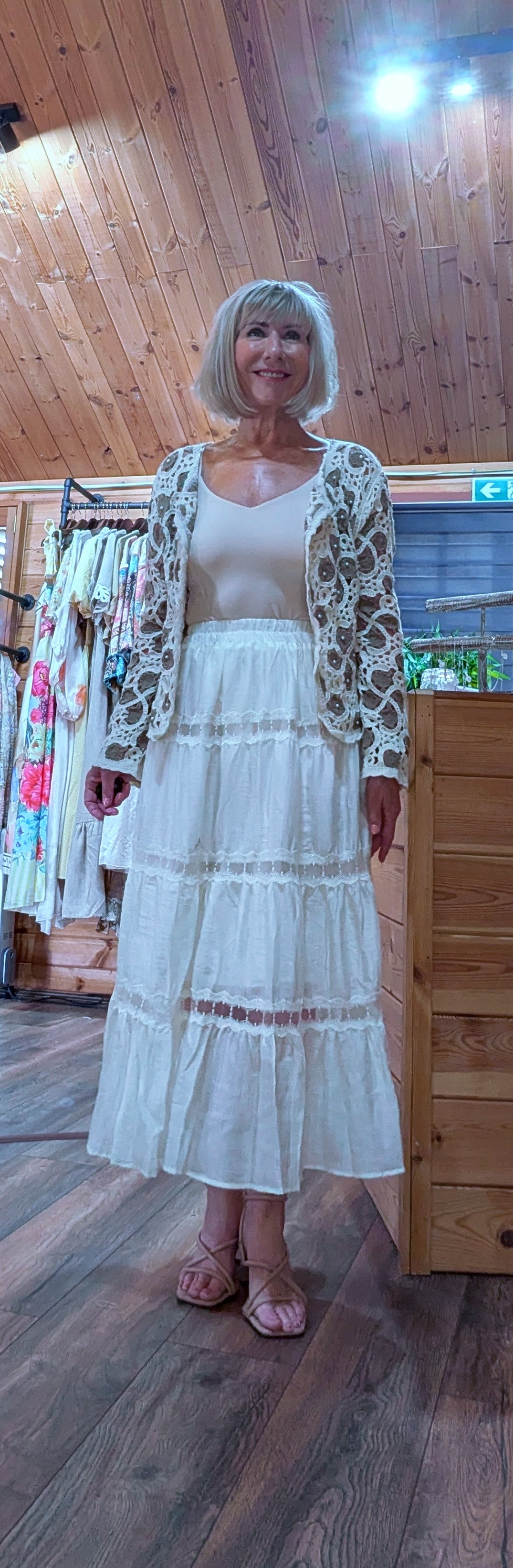 Outfit  with Camilla cotton lace skirt styled with a crochet cardigan