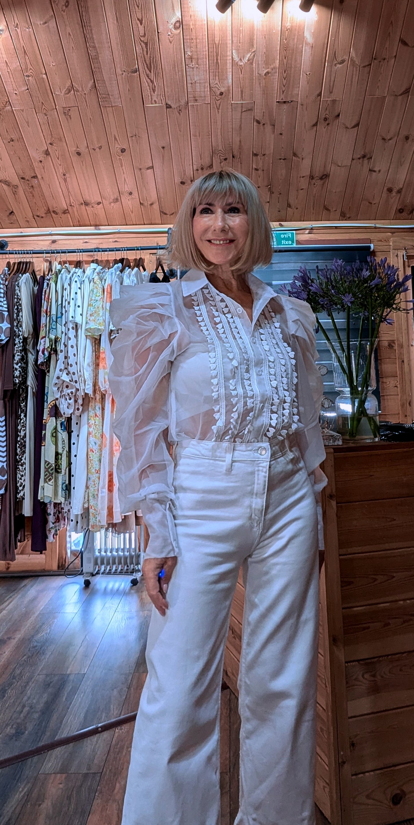 Front view of the Lucille white button-through blouse with delicate lace-style detailing.