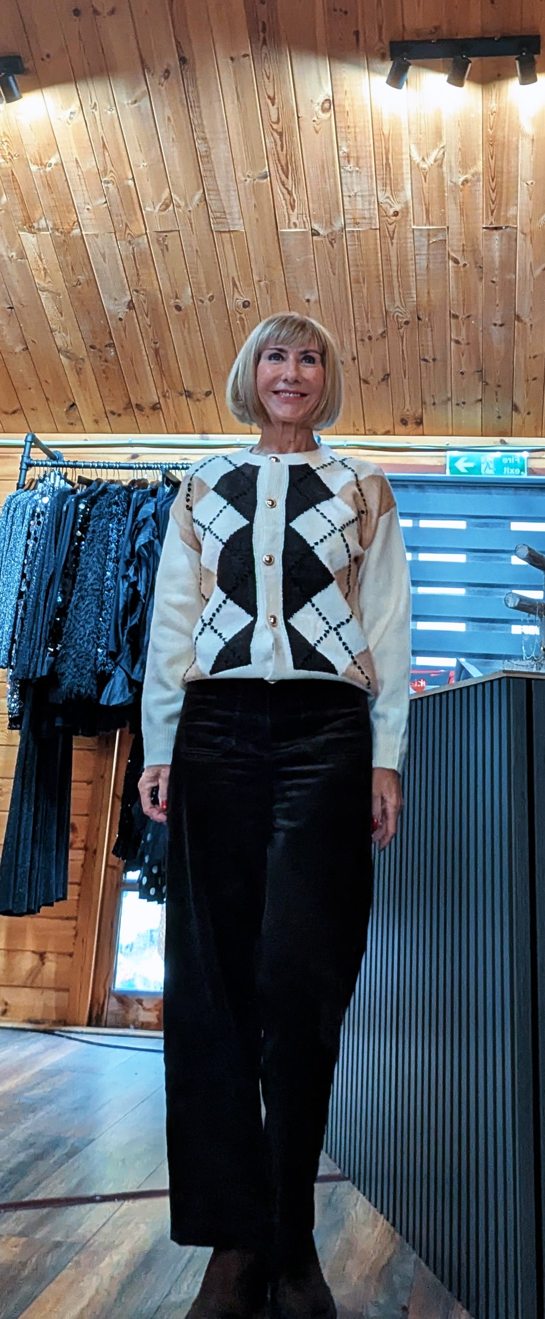 Full front view of the Irene ivory cardigan with contrasting argyle detailing