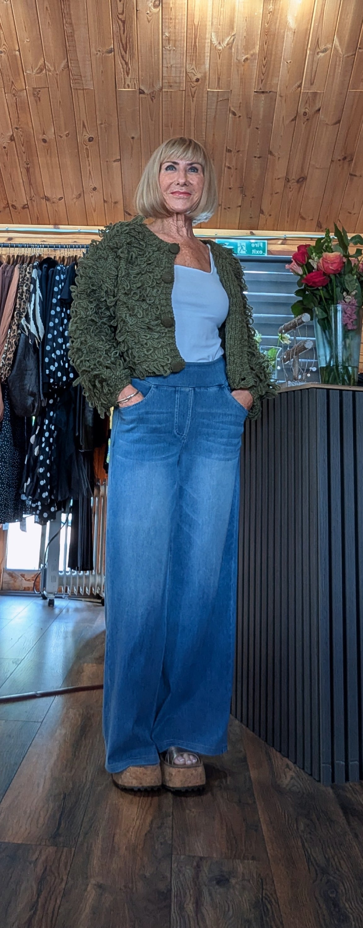 Women’s khaki statement jumper with all-over looped yarn detail styled with wide leg jeans by ditsydi