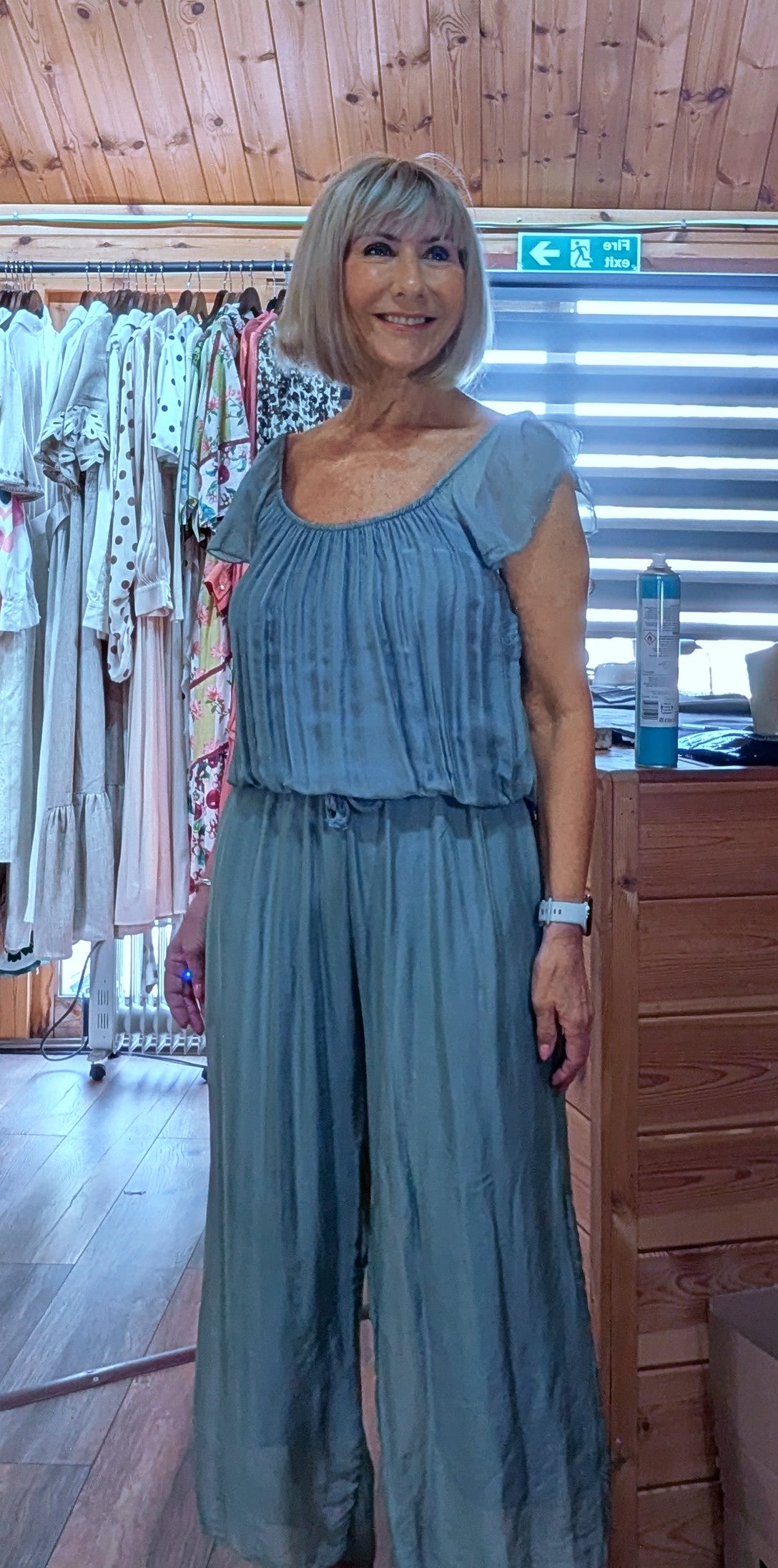 Women's aqua silk blend jumpsuit featuring a wide-leg silhouette, elasticated neckline and comfortable tie waist.