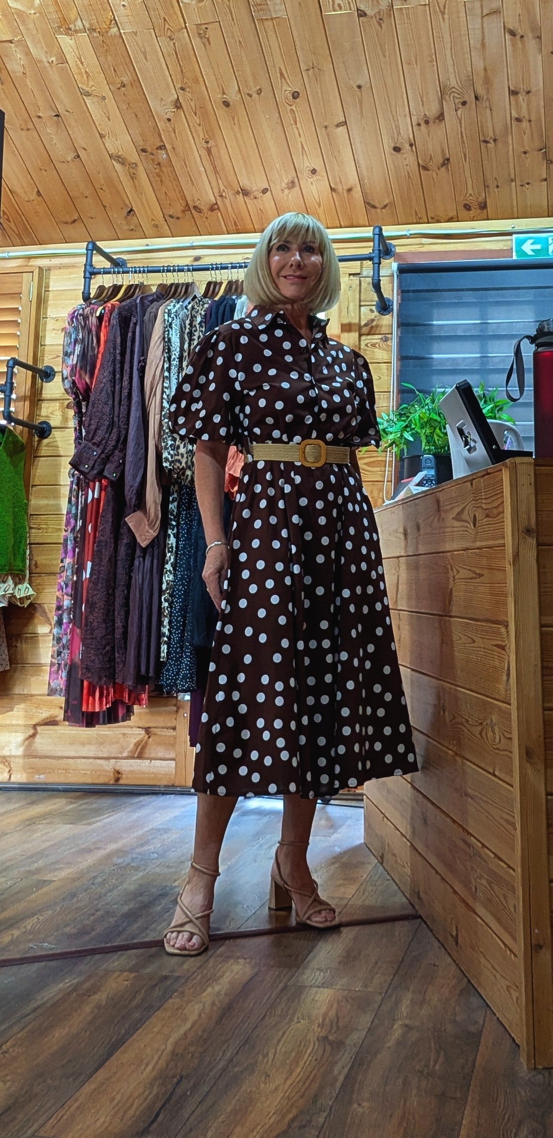 Close-up of the Aoife dress showing the polka-dot print, collar and covered buttons.