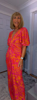 Justina Tropical Green - Fuchsia -Angel Sleeve Maxi Jumpsuit with Twist Detail