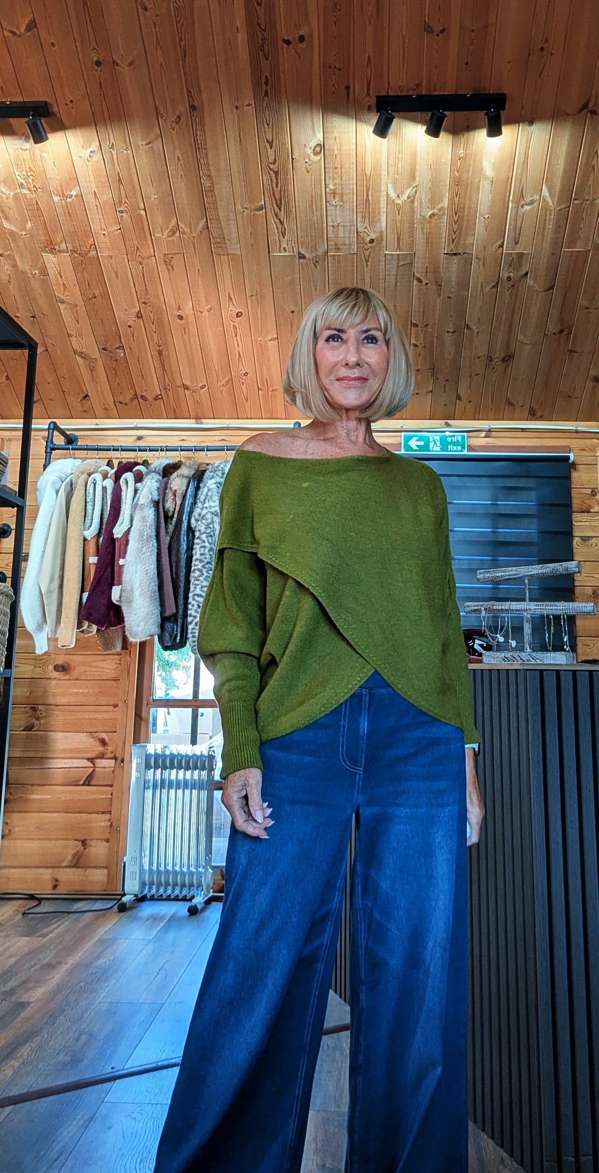 Olive green crossover jumper with relaxed batwing sleeves