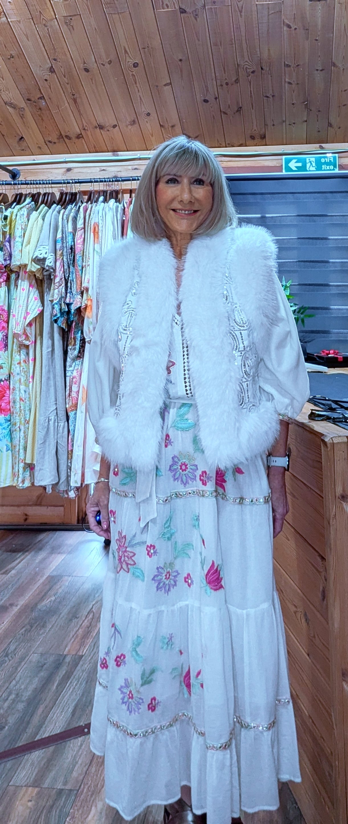 Close up of a white faux fur gilet styled by ditsydi