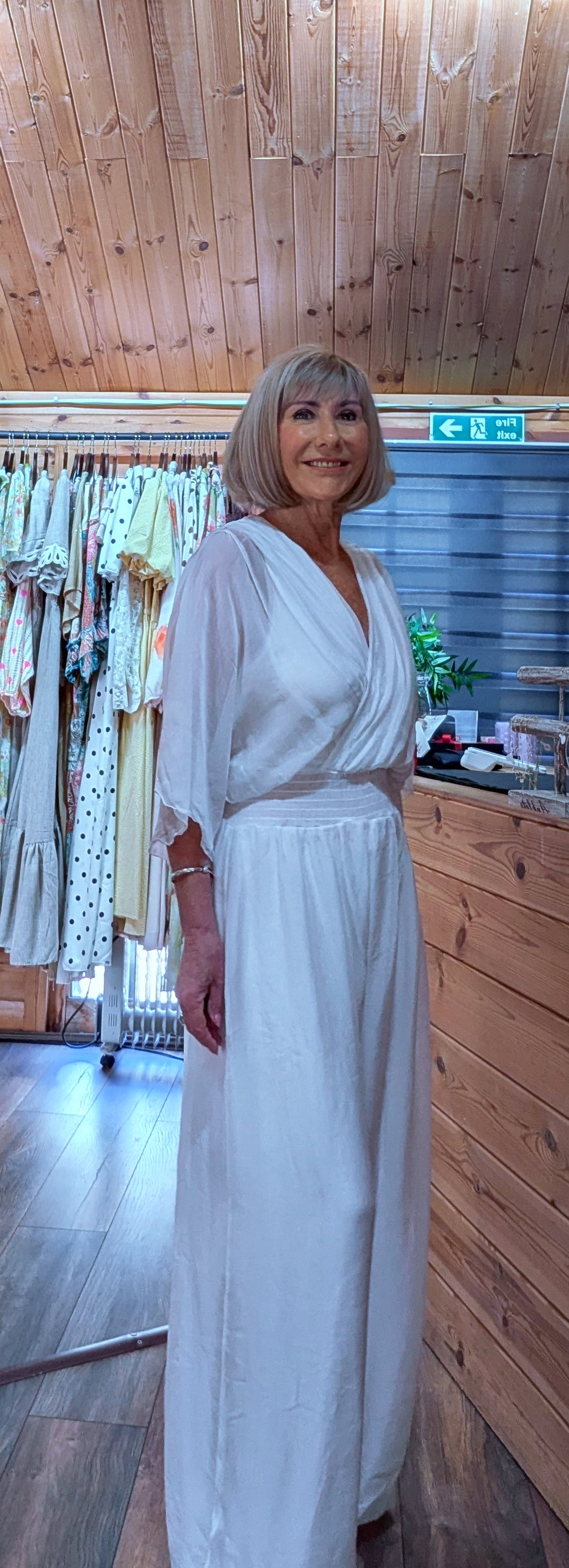 White silk jumpsuit with bubble hem