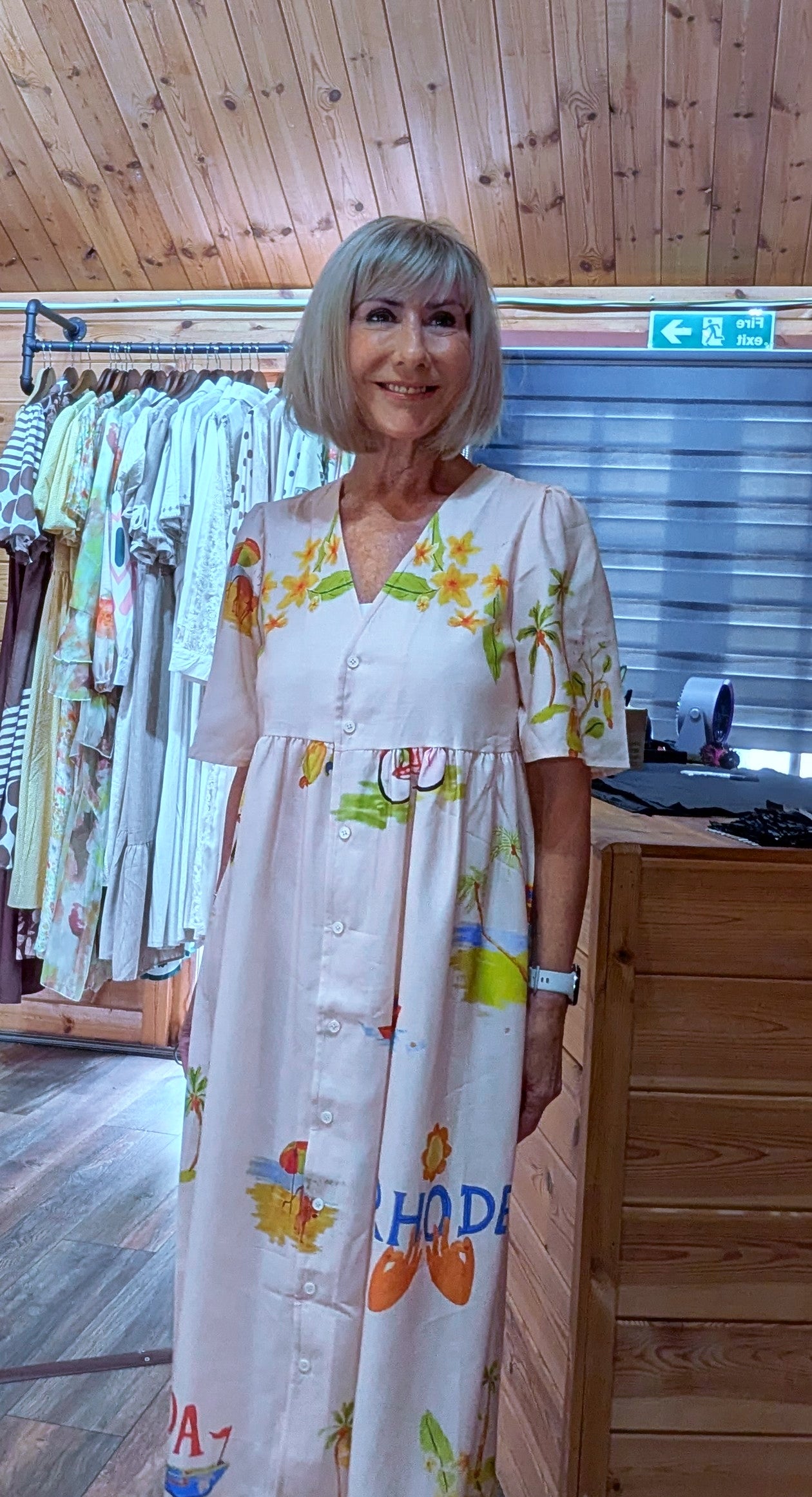 Women’s printed puff sleeve midi dress available in sizes Small to XL