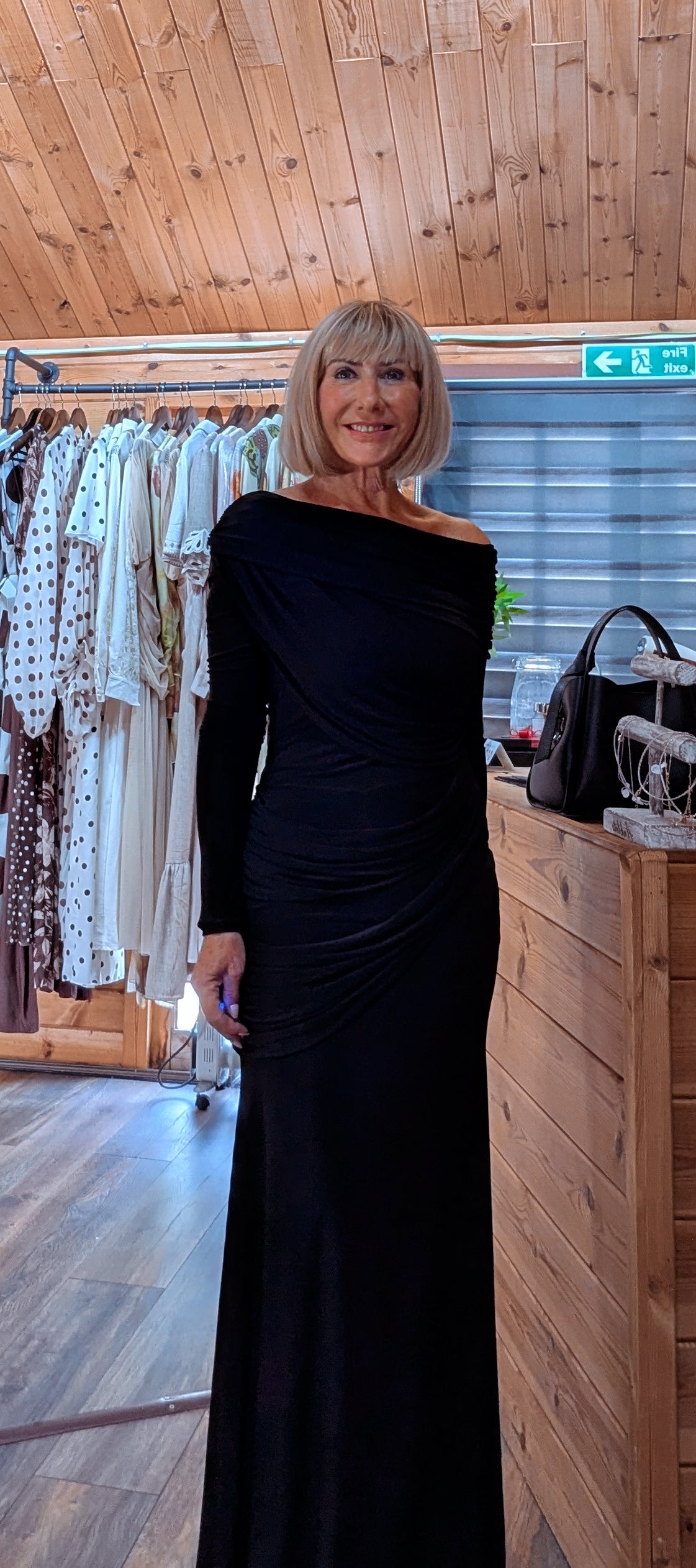 Tilda elegant black wedding guest dress with a flattering figure-skimming fit.