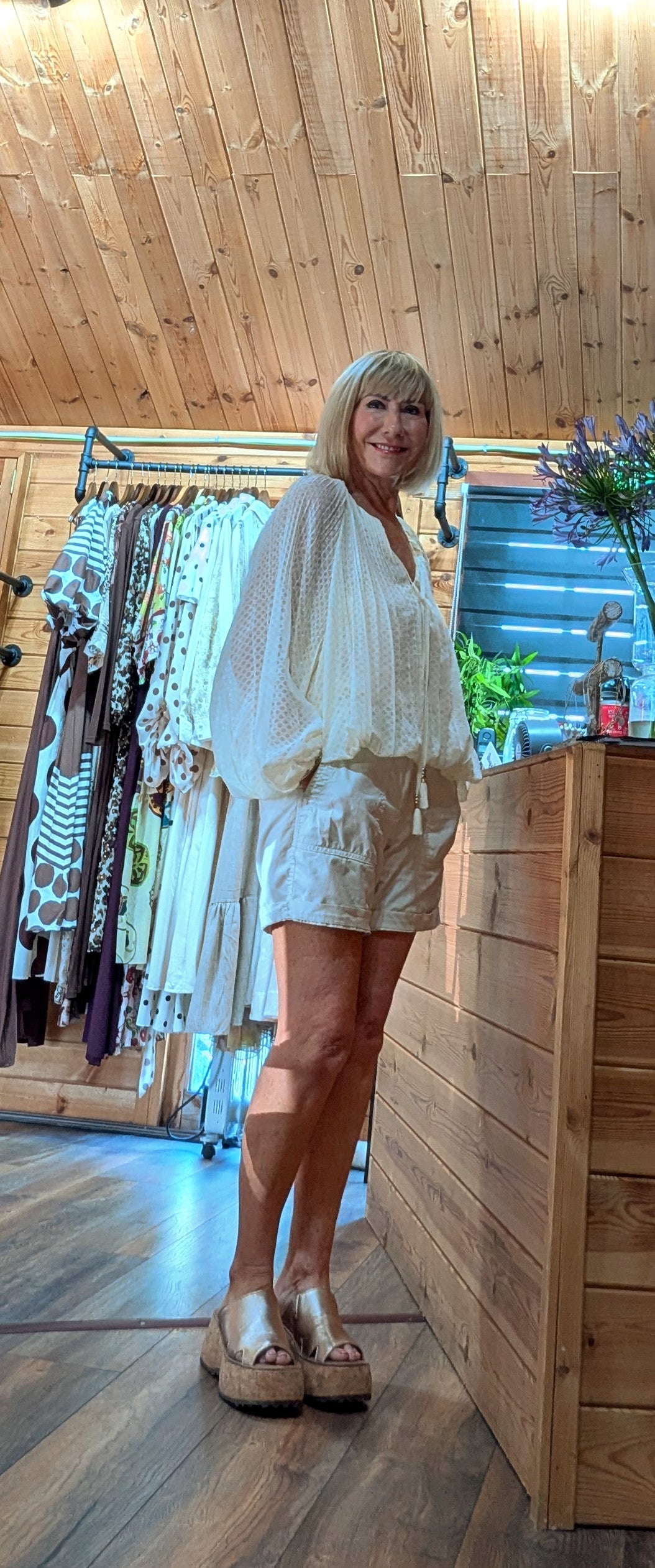 Woman wearing the Jasmine lightweight viscose blouse in the DitsyDi boutique.