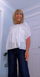 Clover White Silk Boho Blouse – Balloon Sleeves & Embroidered Floral Detail