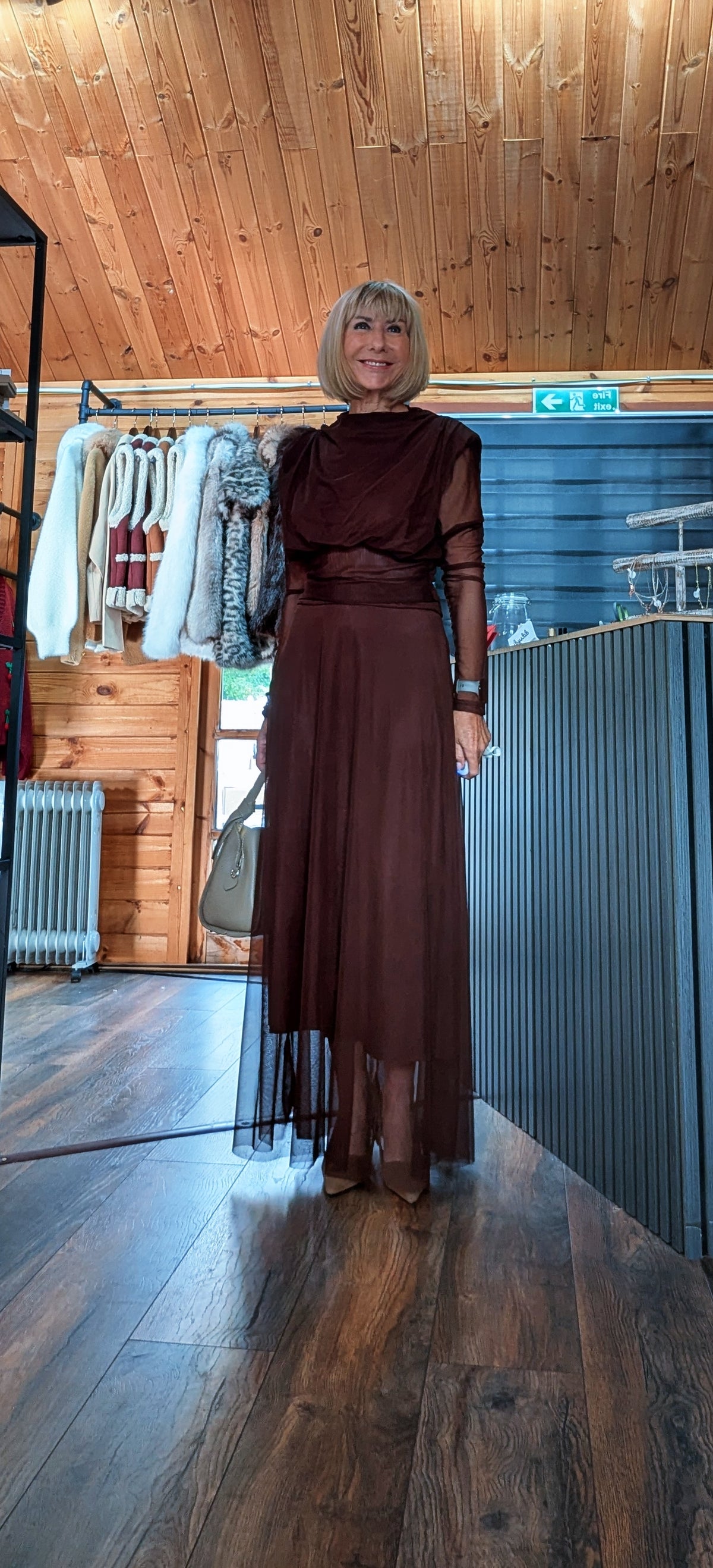 Full-length view of Harlow chocolate top and flowing skirt worn with dark shoes