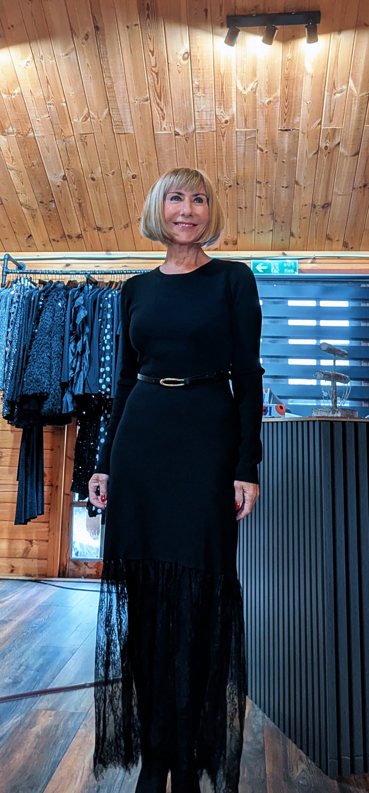 Closer front view of the Aoife dress, showing the round neckline, long sleeves and slim belt