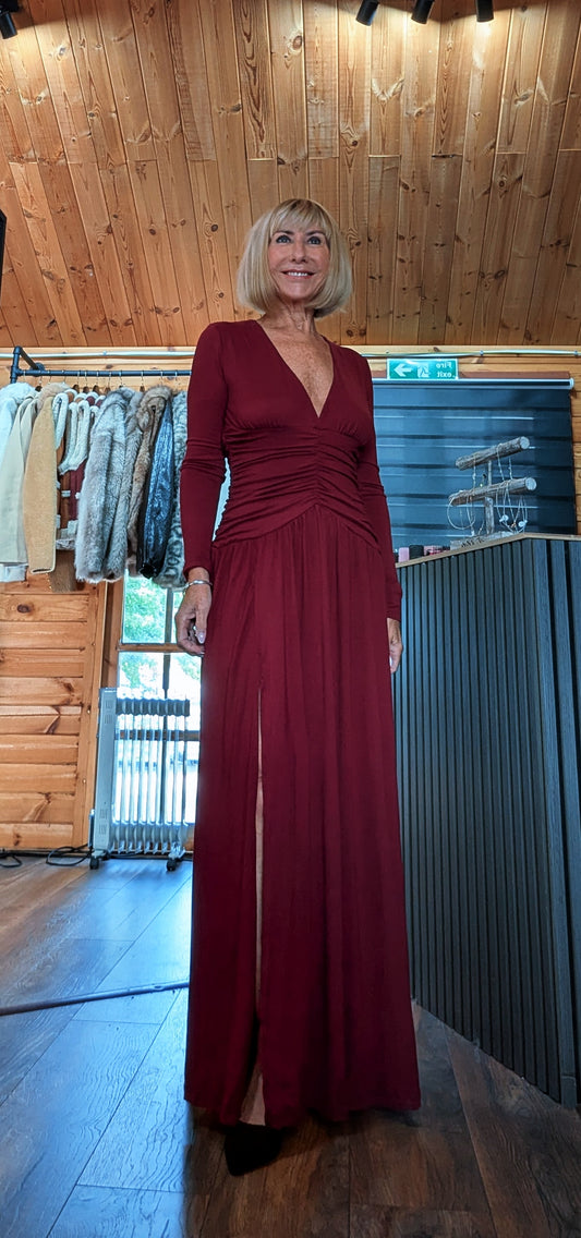 Eadie burgundy long-sleeved maxi dress with a ruched drop waist and front split
