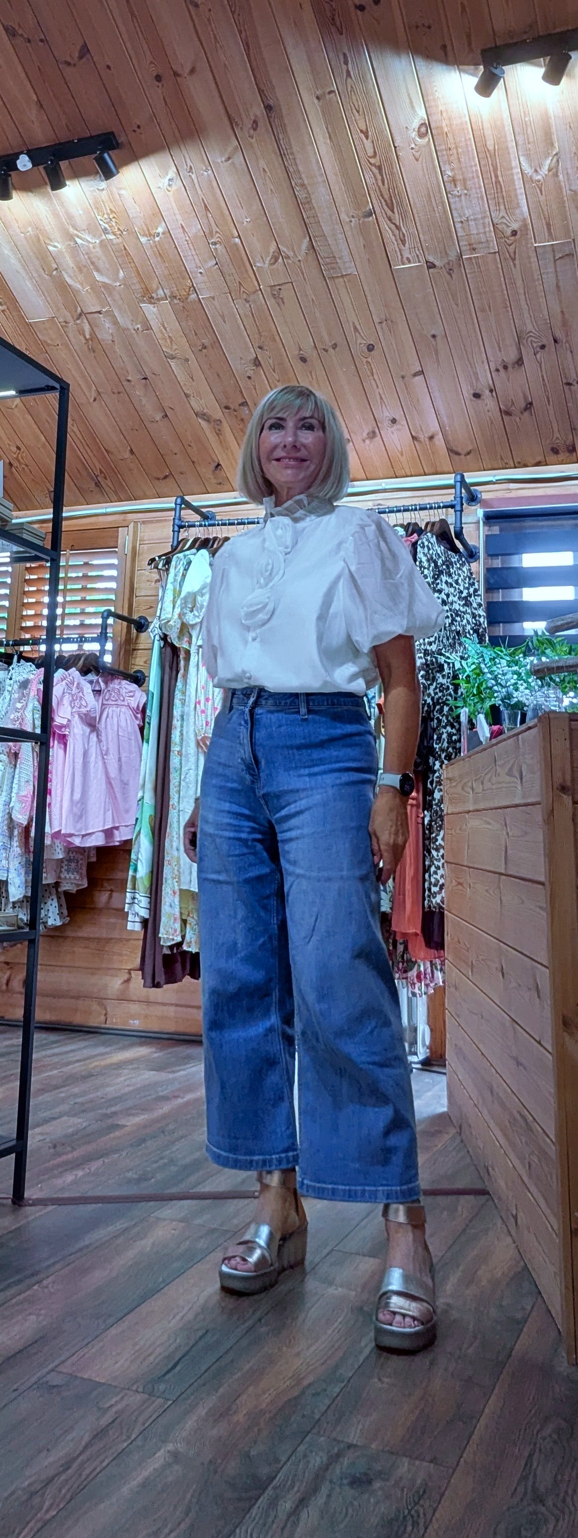 Model wearing the Estelle ivory embellished blouse styled with  jeans and sandals outfit of the day