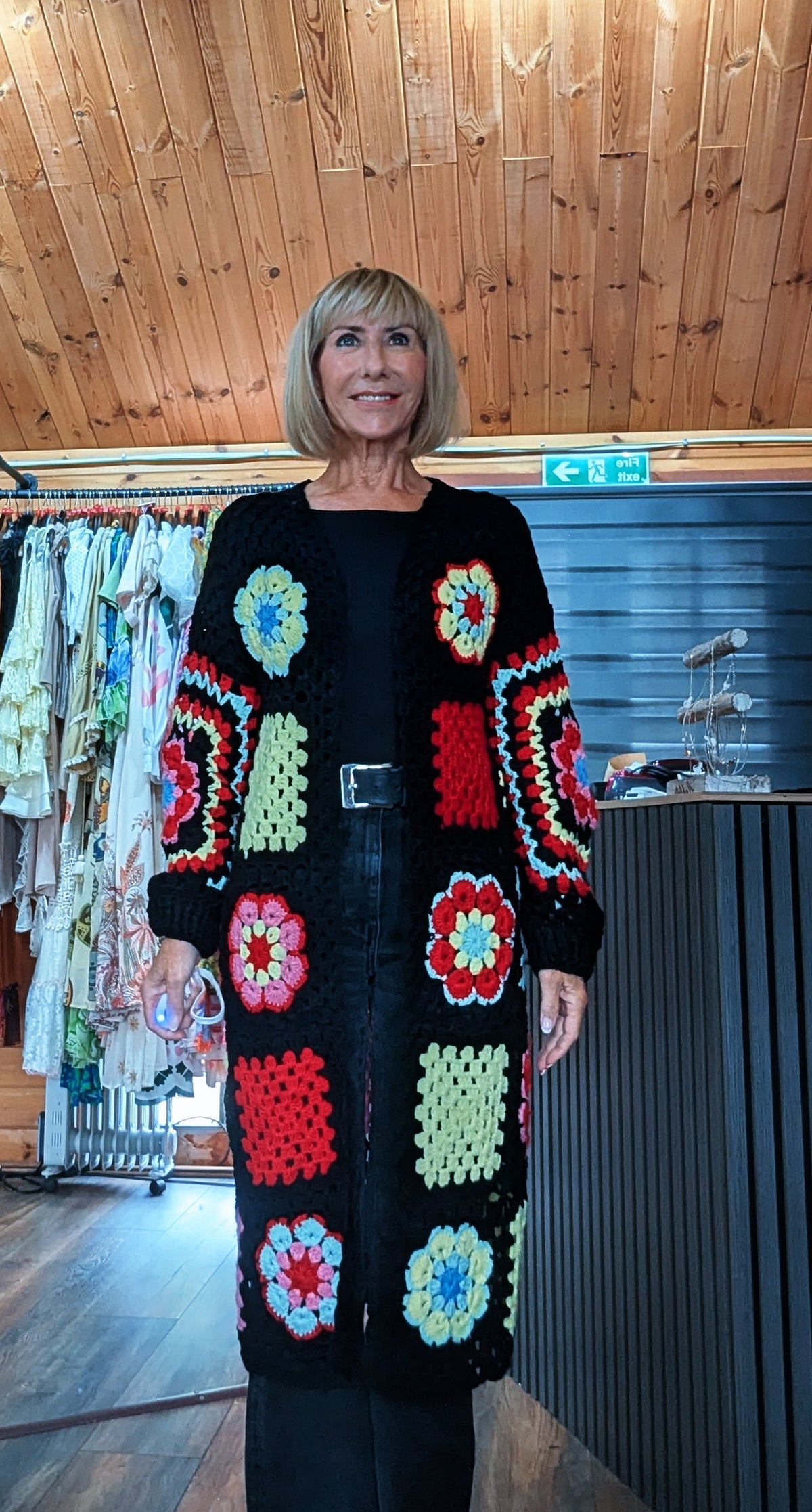 Fia women’s longline floral crochet-style cardigan in black, fitting UK sizes 8–14
