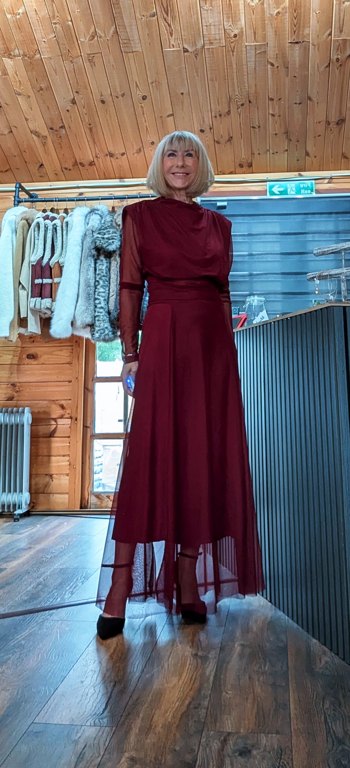 Harlow burgundy two-piece evening set showing the full skirt length and sheer hem