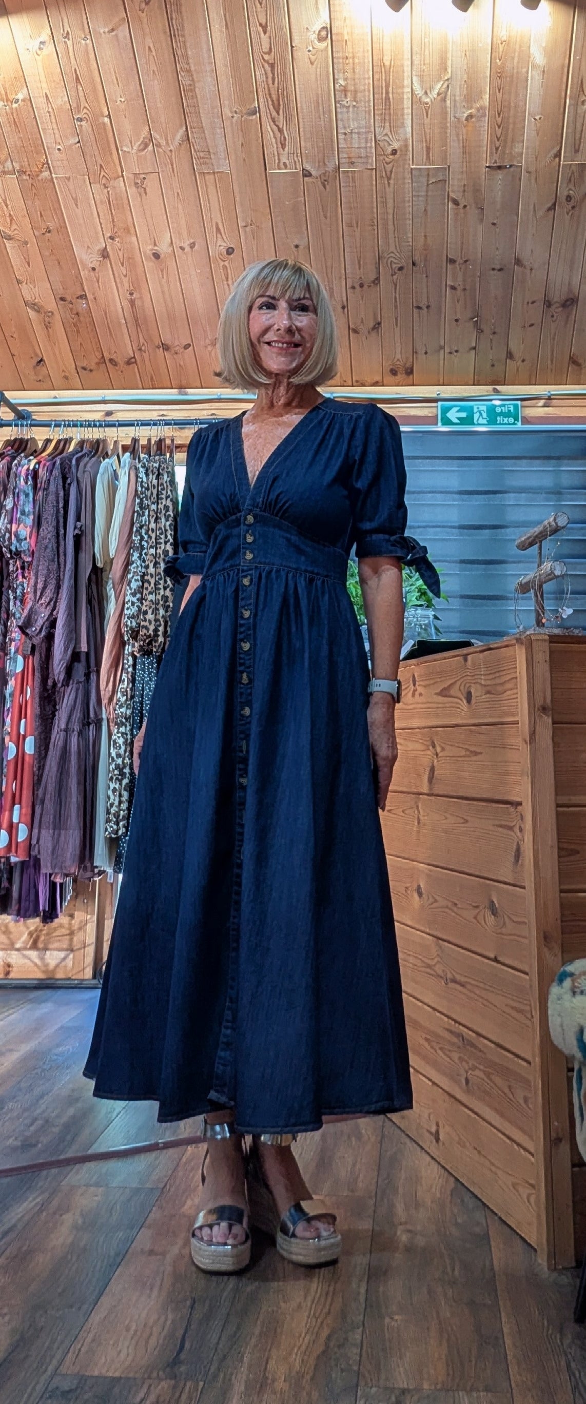 Binty dark navy blue midi dress with puff sleeves and a button-down front, worn with silver wedges 