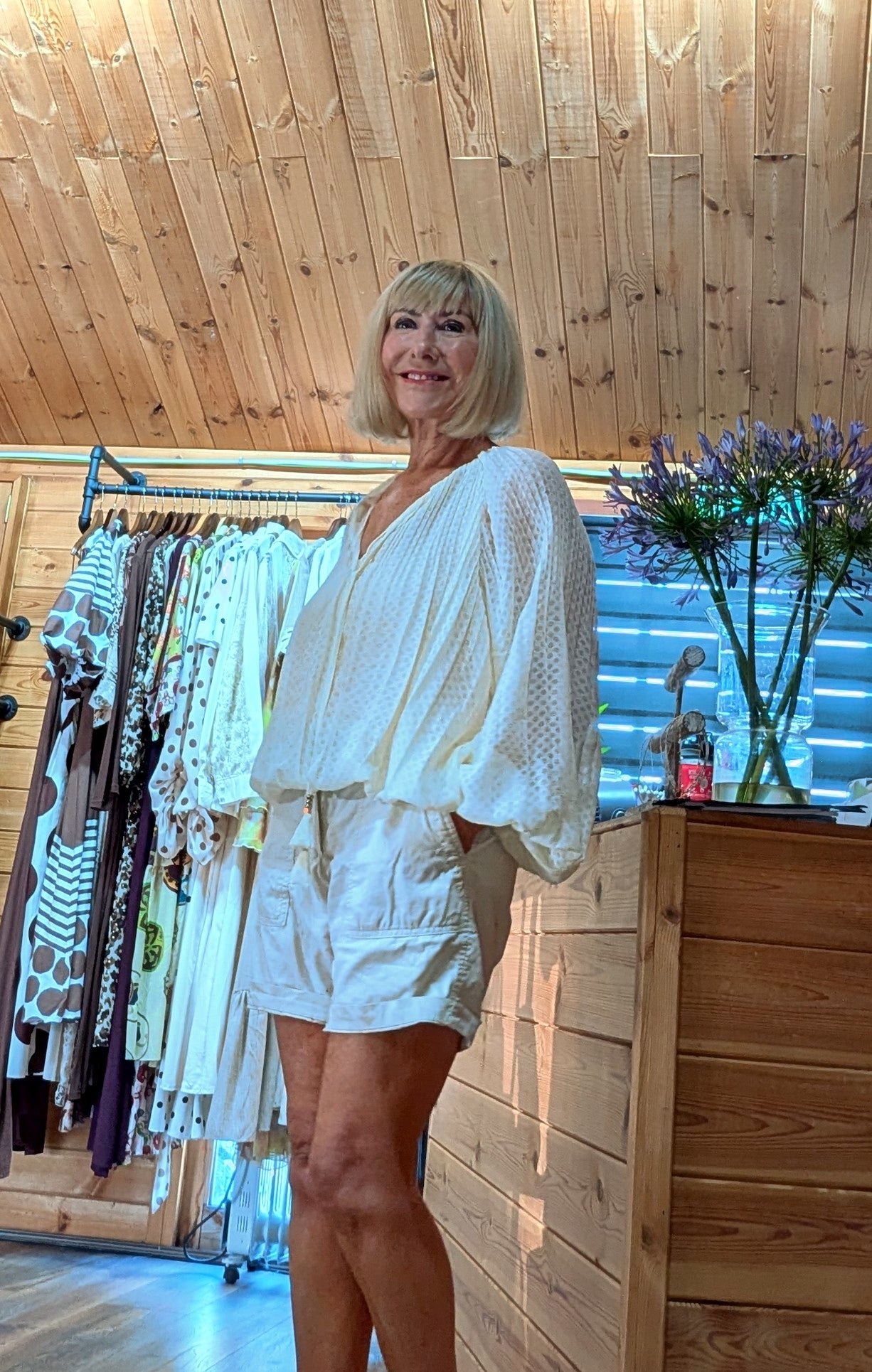 Side view Woman wearing the Jasmine lightweight viscose  blouse in the DitsyDi boutique.