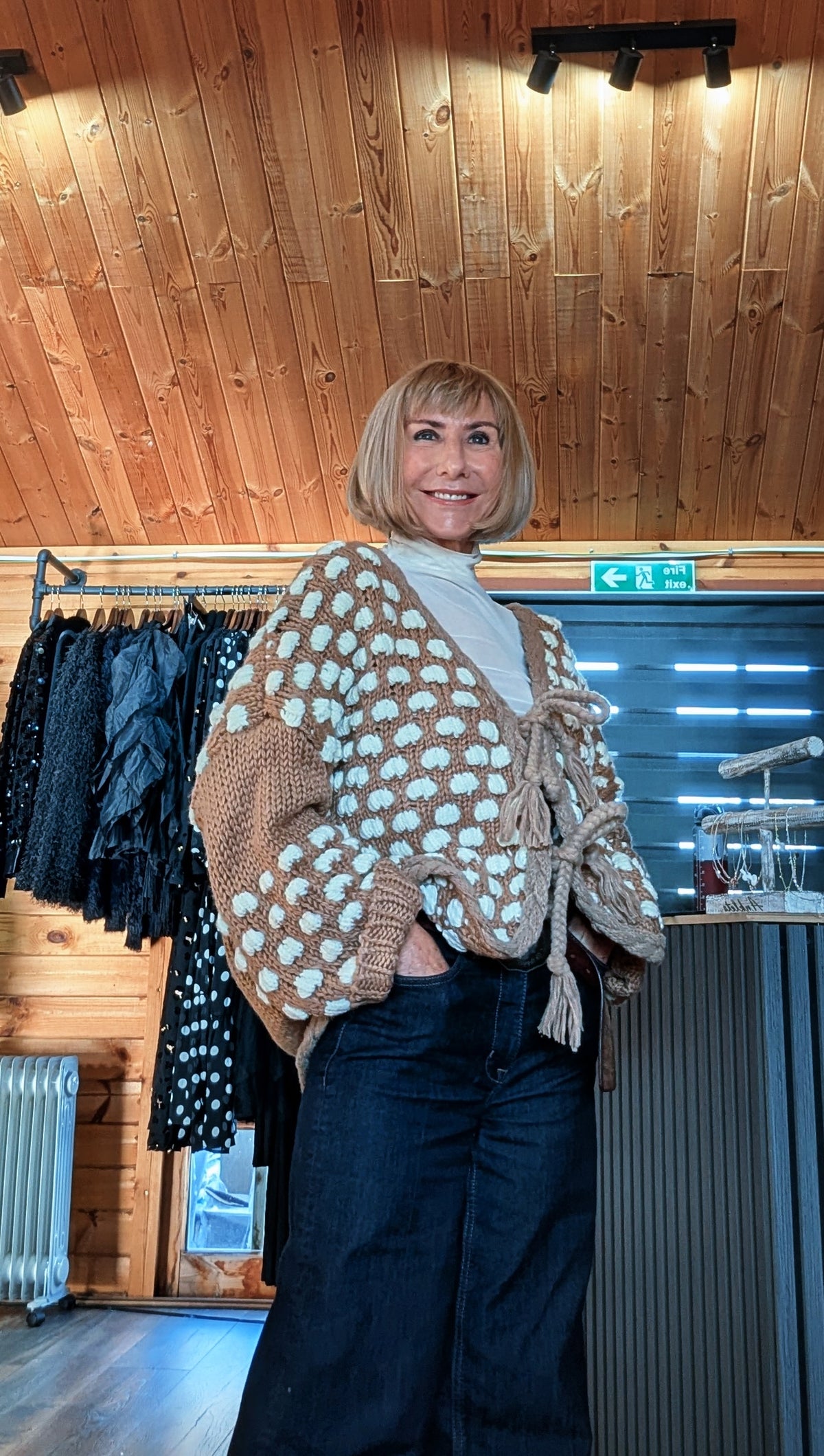 Side view of Abby cardigan showing cream bobbles and roomy balloon sleeves