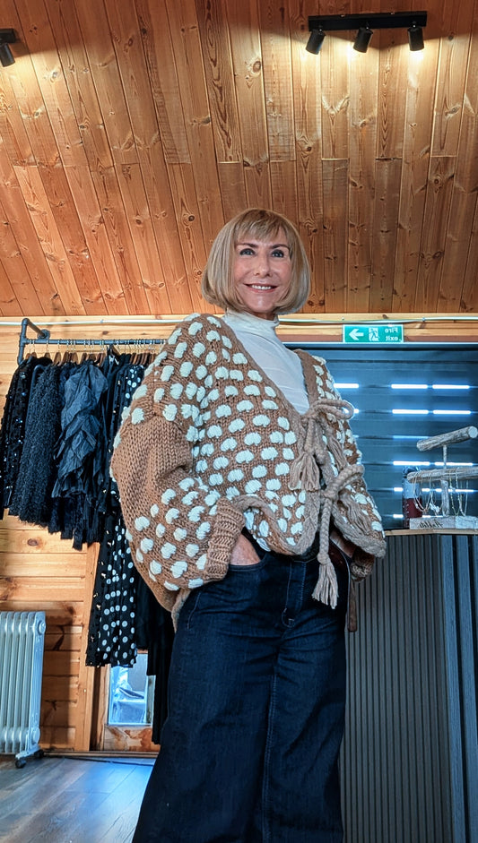 Side view of Abby cardigan showing cream bobbles and roomy balloon sleeves