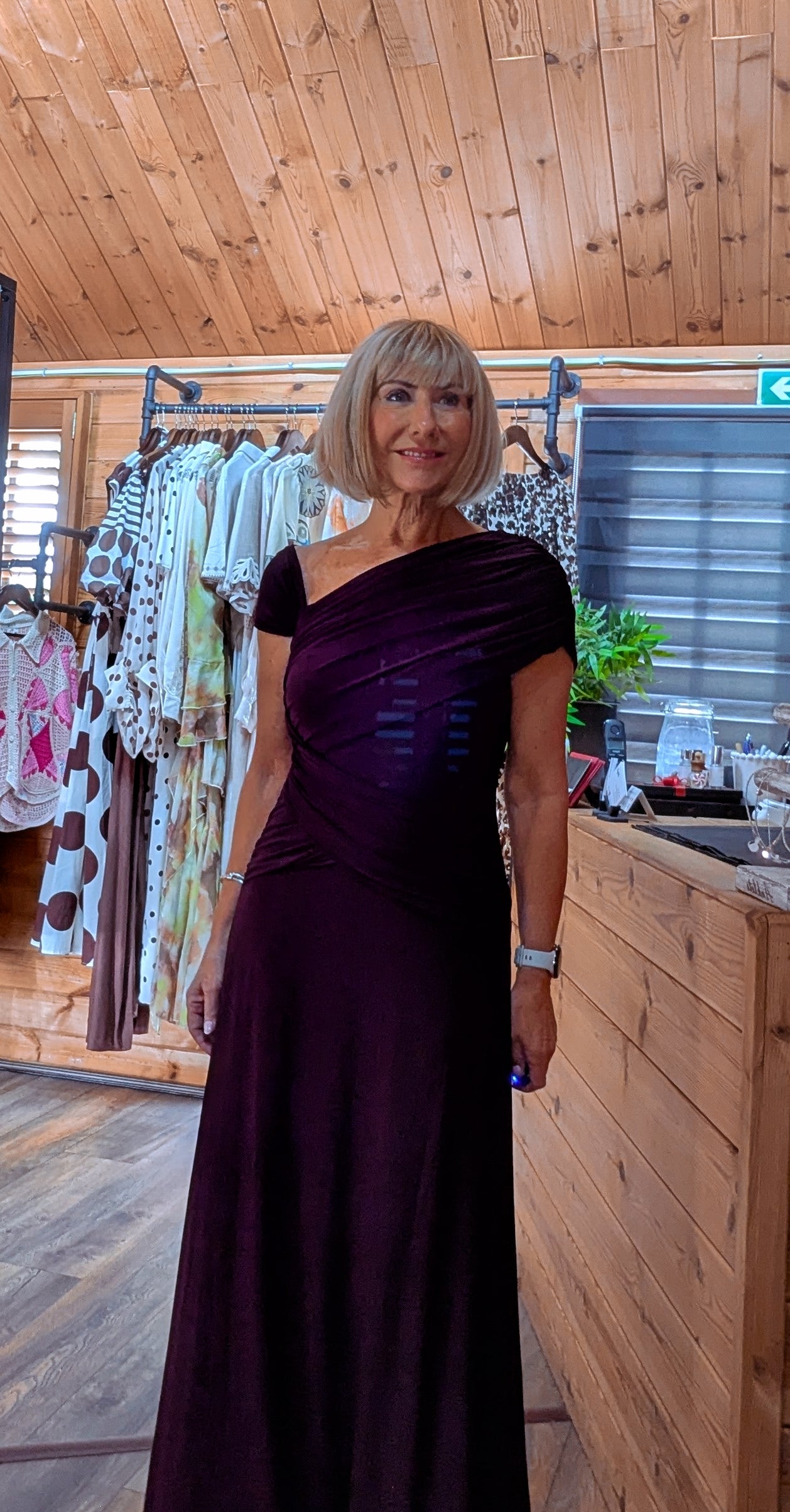 Close up view Imogen burgundy occasion dress with side gathering and capped sleeves