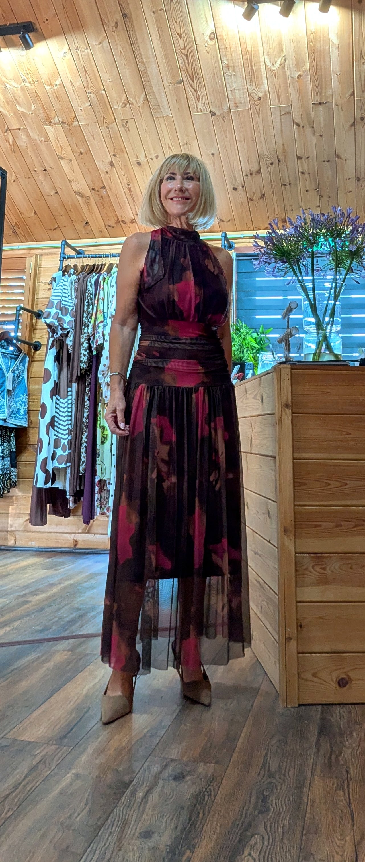flattering occasion dress in deep autumn tones with a draped ruched waist and high neck