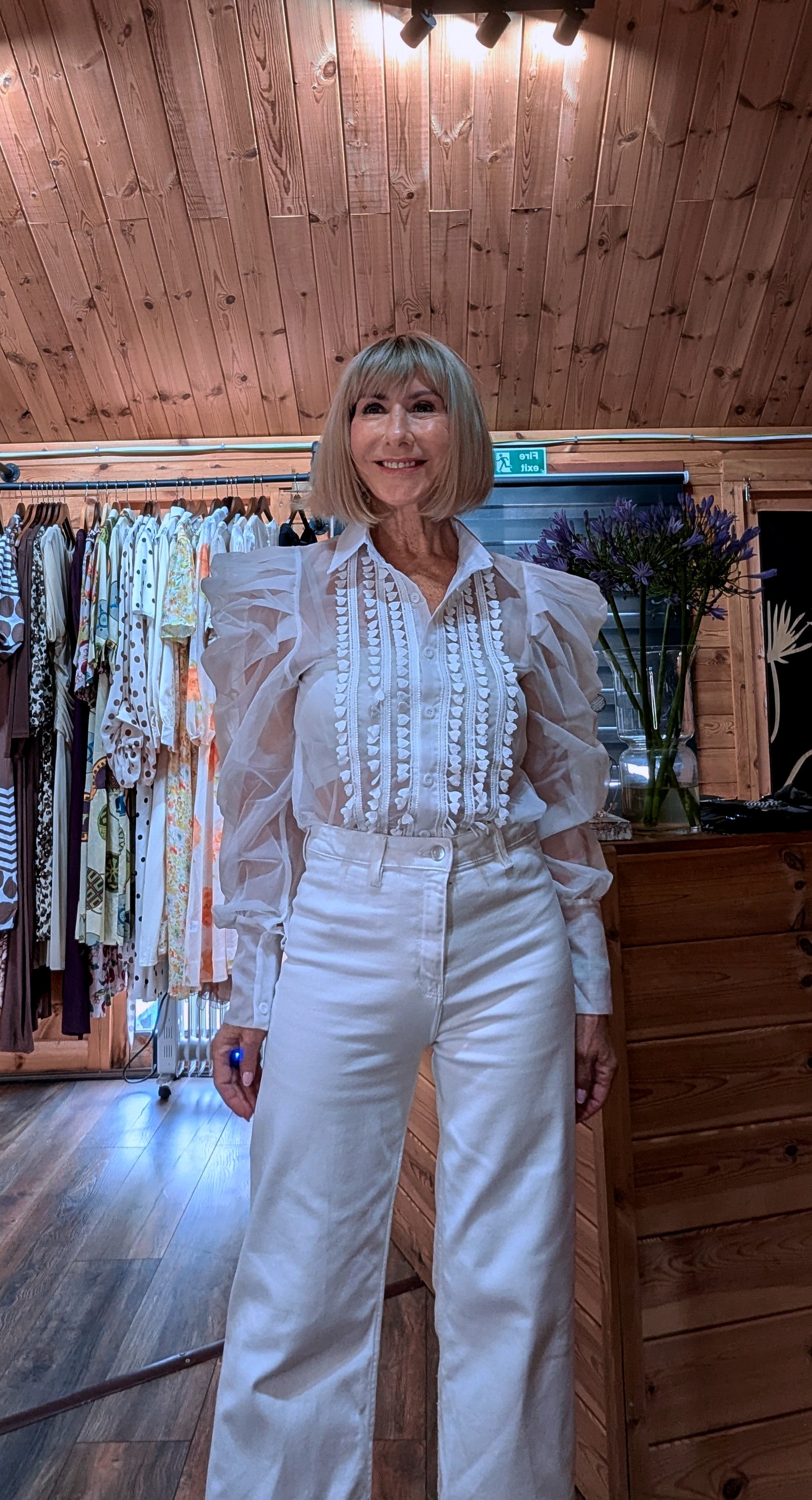 Side view of the Lucille sheer blouse with dramatic puff sleeves.