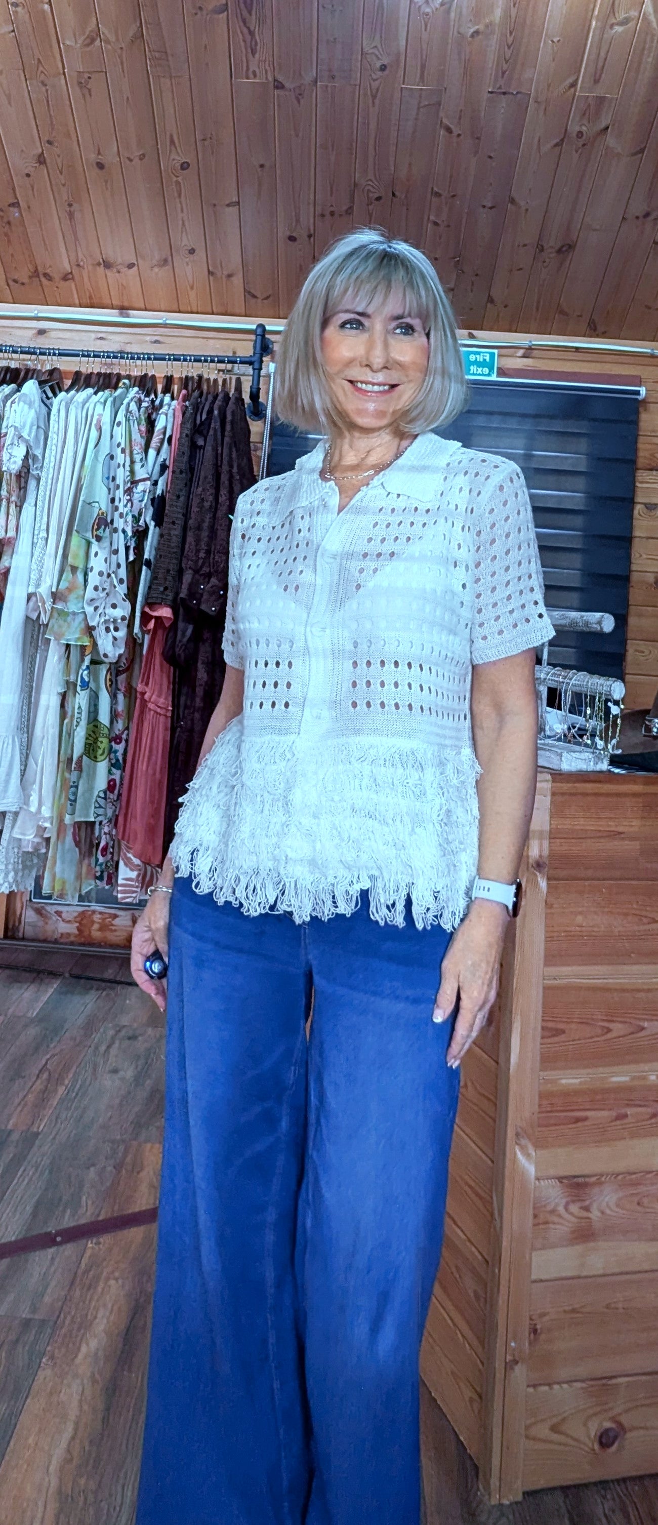 Close up of cream crochet top with fringe detail styled by ditsydi