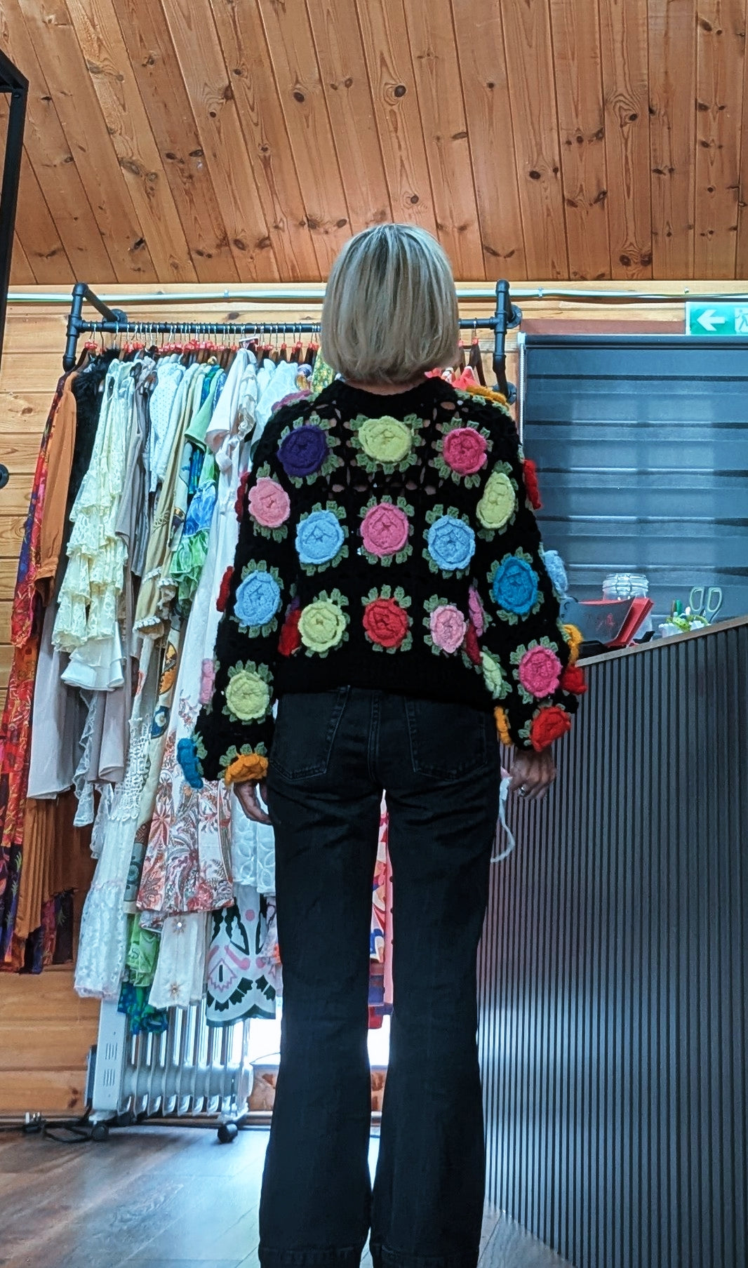 Ora black knitted crochet cardigan featuring colourful three-dimensional florals
