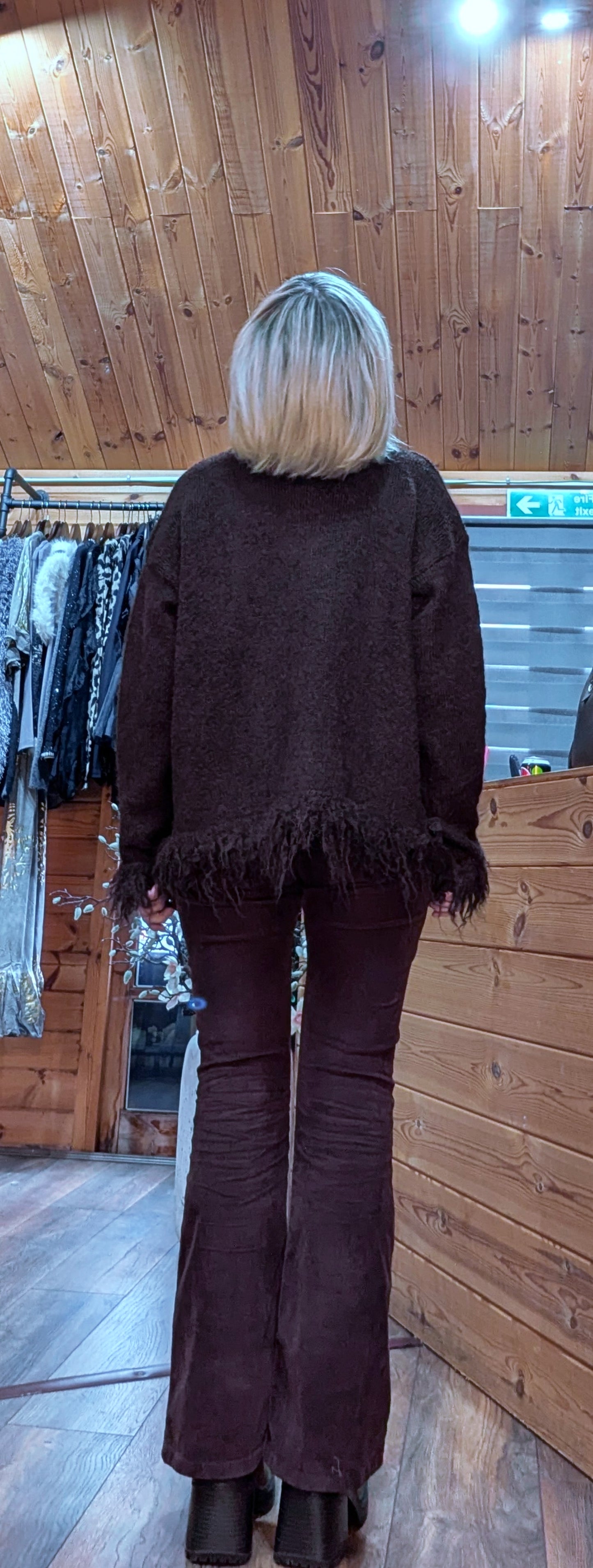 Oversized warm brown cardigan rear view with funky fringe cuffs