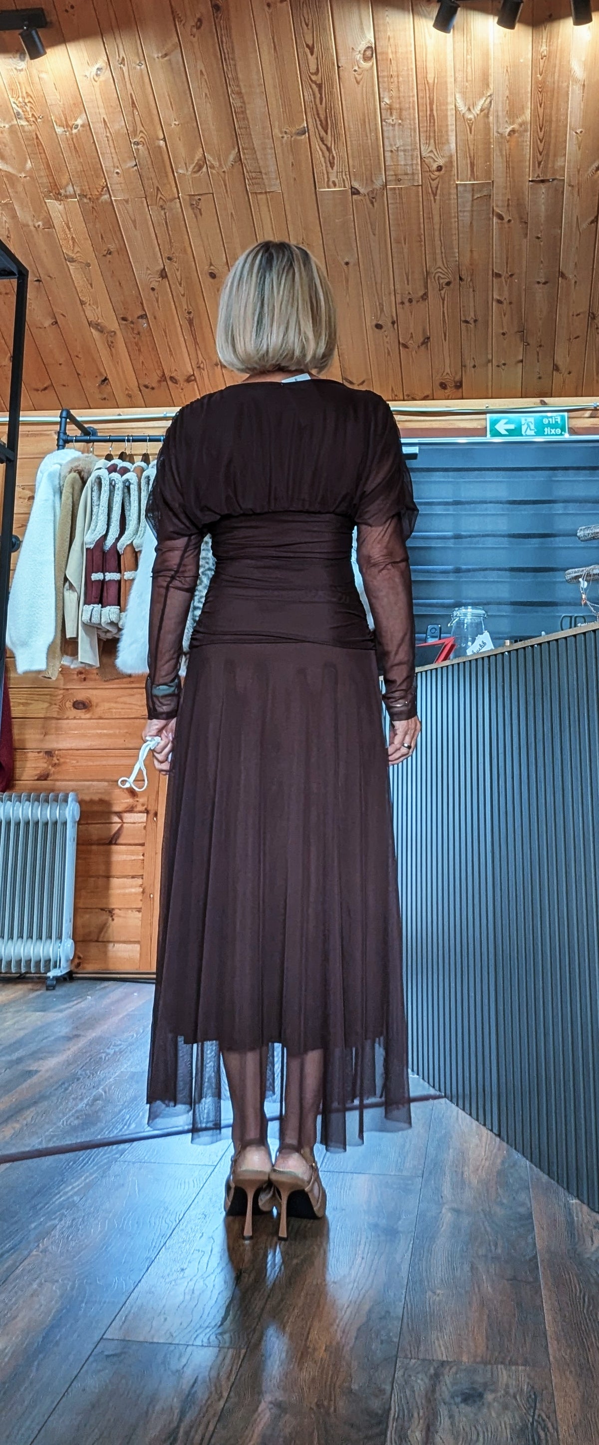 Back view of Luna chocolate tulle dress showing the ruched waist and sheer skirt overlay
