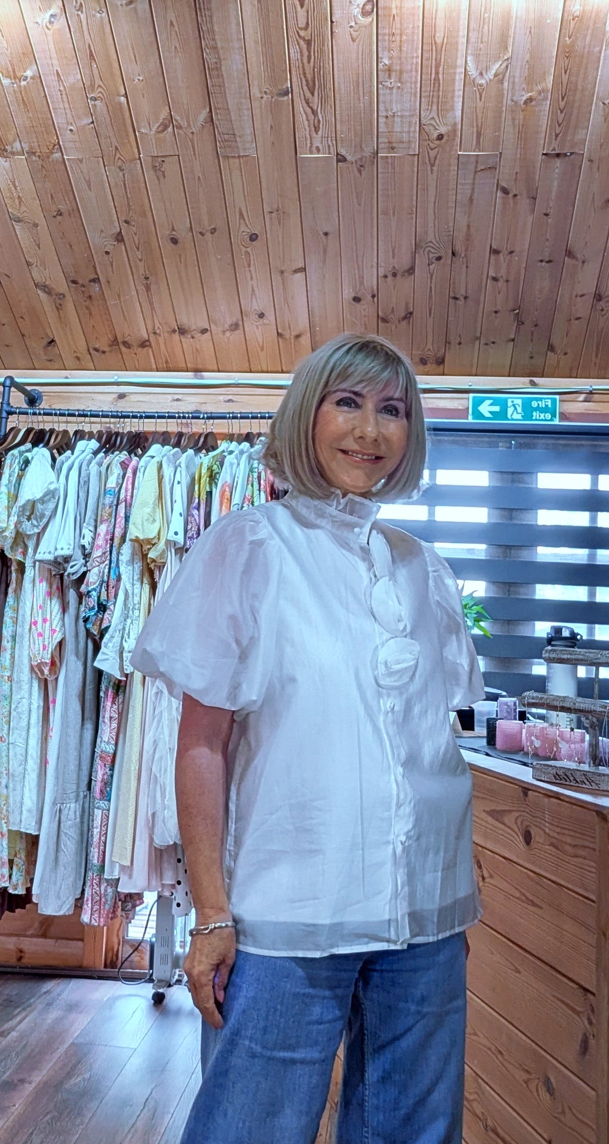 Women's ivory occasion blouse featuring floral appliqué, short puff sleeves and button front