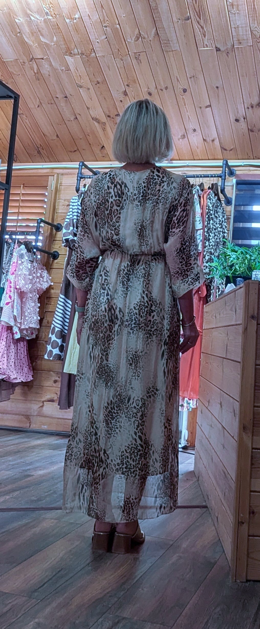 Rear view of leopard print silk blend dress, a lightweight maxi dress with a wrap-style bodice, perfect for holidays, evenings and special occasions.